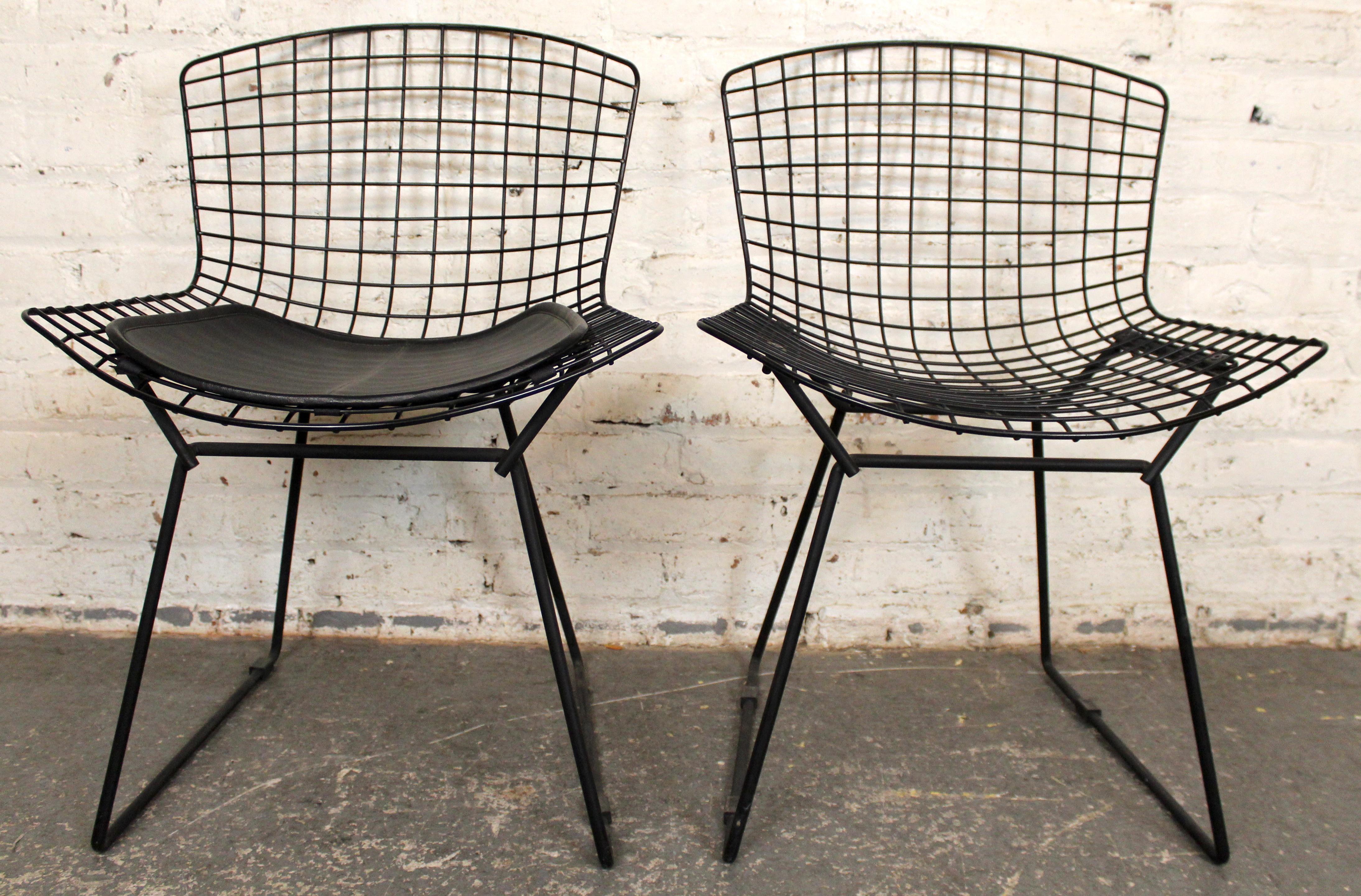 A striking duo of mid-century-modern dining chairs inspired by the iconic design by Harry Bertoia for Knoll. Featuring open, airy chrome-wire construction, these chairs combine sculptural presence with functional livability — their geometric