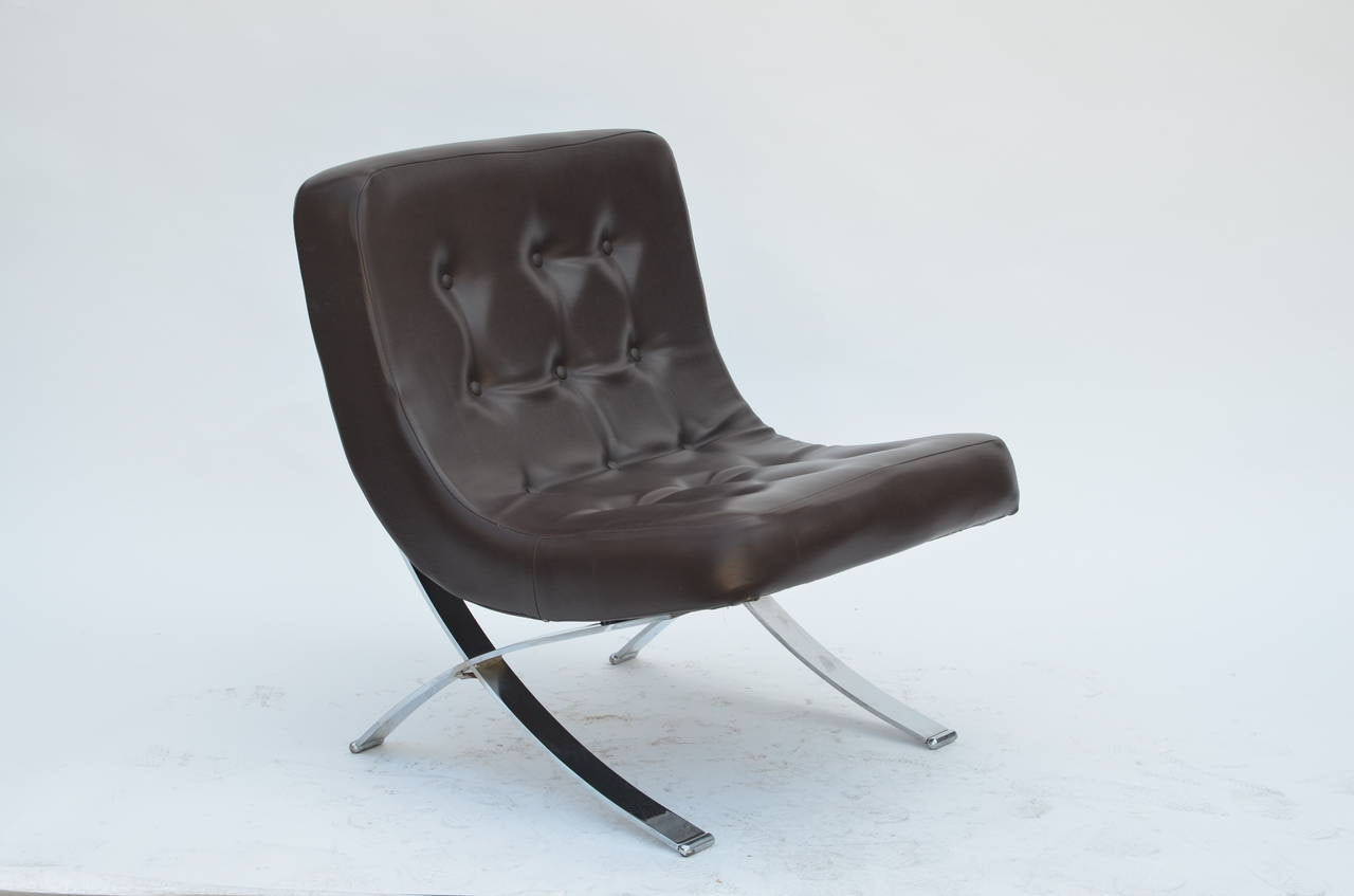 Pair of chromed Italian 1970s slipper chairs. Original dark brown vinyl seats in excellent condition. Great vintage design for a change from the Barcelona chair.