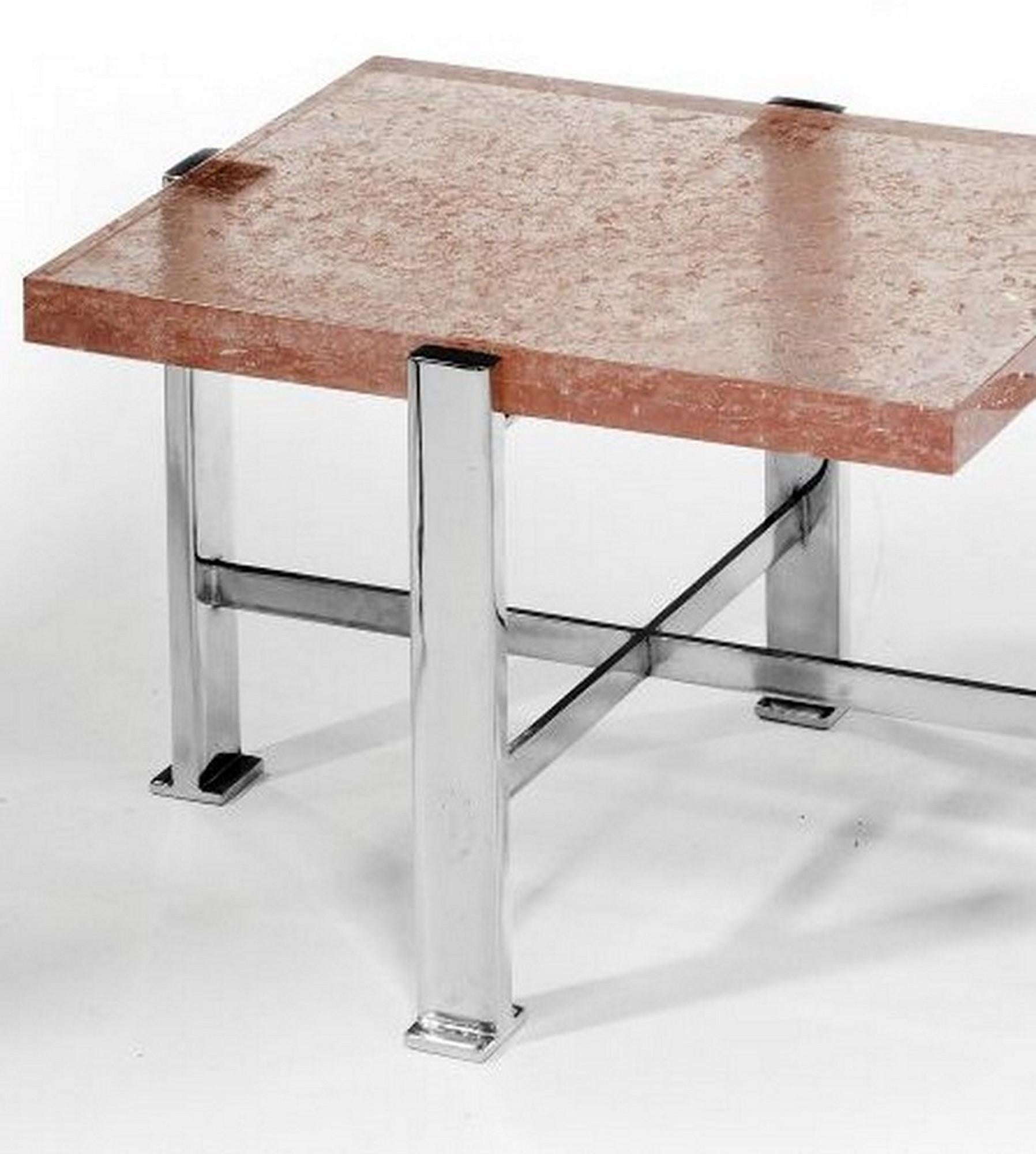 Pair of side tables with chromed metal base and rose colored resin top. Attributed to Pierre Giraudon. These unusual tables would work equally well as side tables or bedside tables. 
There are some areas of light oxidation to the legs consistent