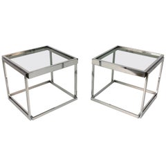 Pair of chromed metal coffee tables with smoked glass. Stackable. Italy 1970s