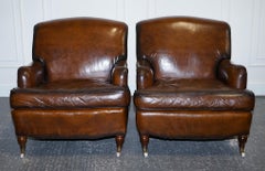 PAIR OF CIGAR HAND DYED LEATHER HOWARD & SONS STYLE ARMCHAiRS ON CASTOR FEET