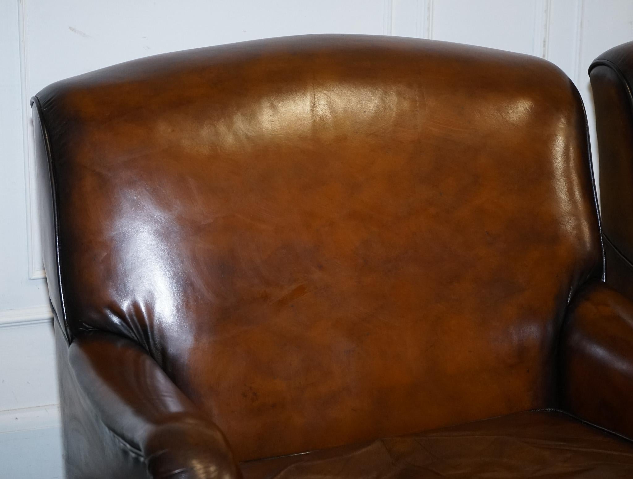 British PAIR OF CIGAR HAND DYED LEATHER HOWARD & SONS STYLE ARMCHAiRS ON CASTOR FEET For Sale