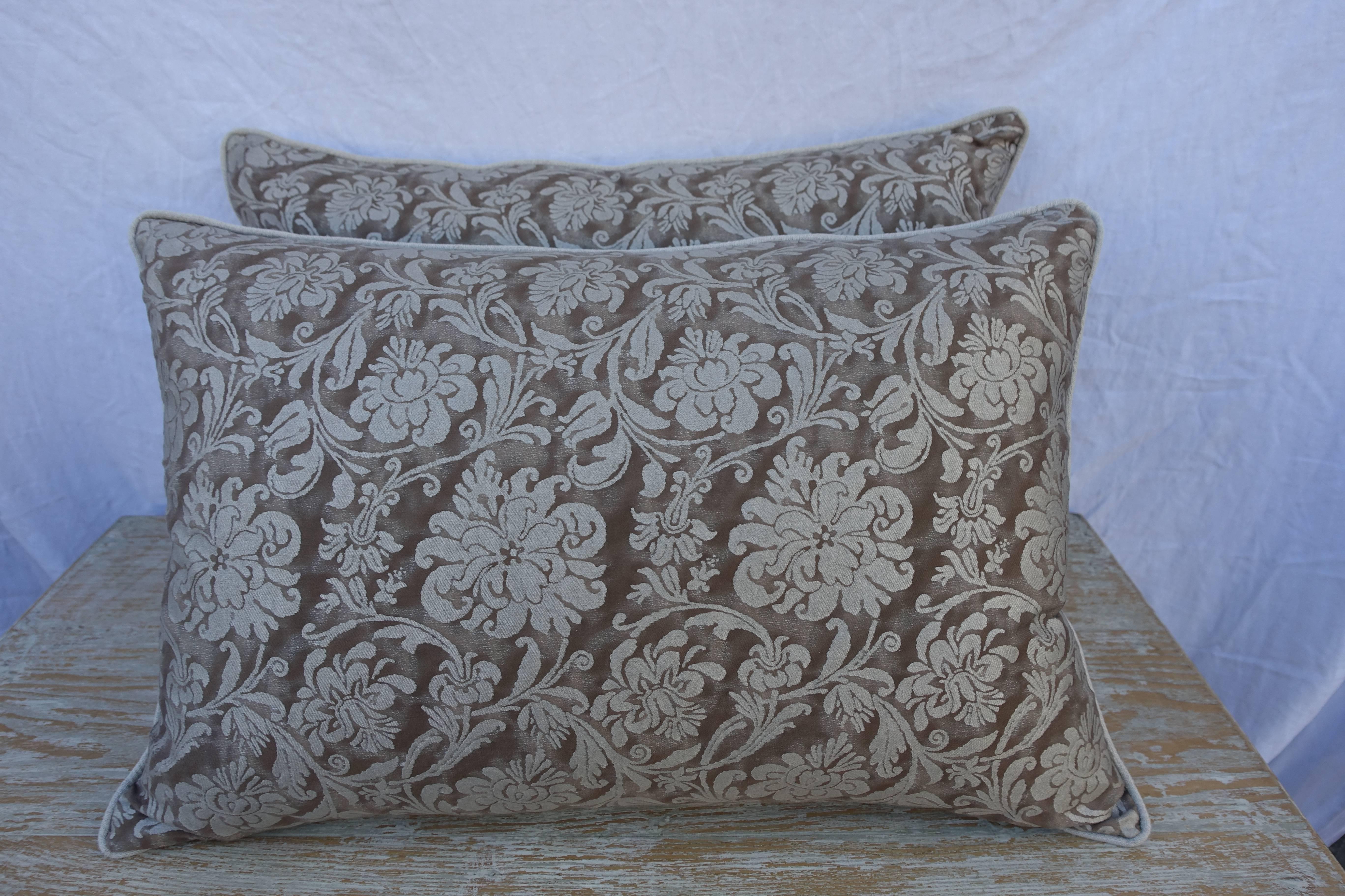 Custom pair of Italian Fortuny pillows made with Fortuny's Cimarosa patterned greyish brown and silvery gold printed cotton fronts and natural colored linen backs with a self welt detail. Down inserts, sewn closed.