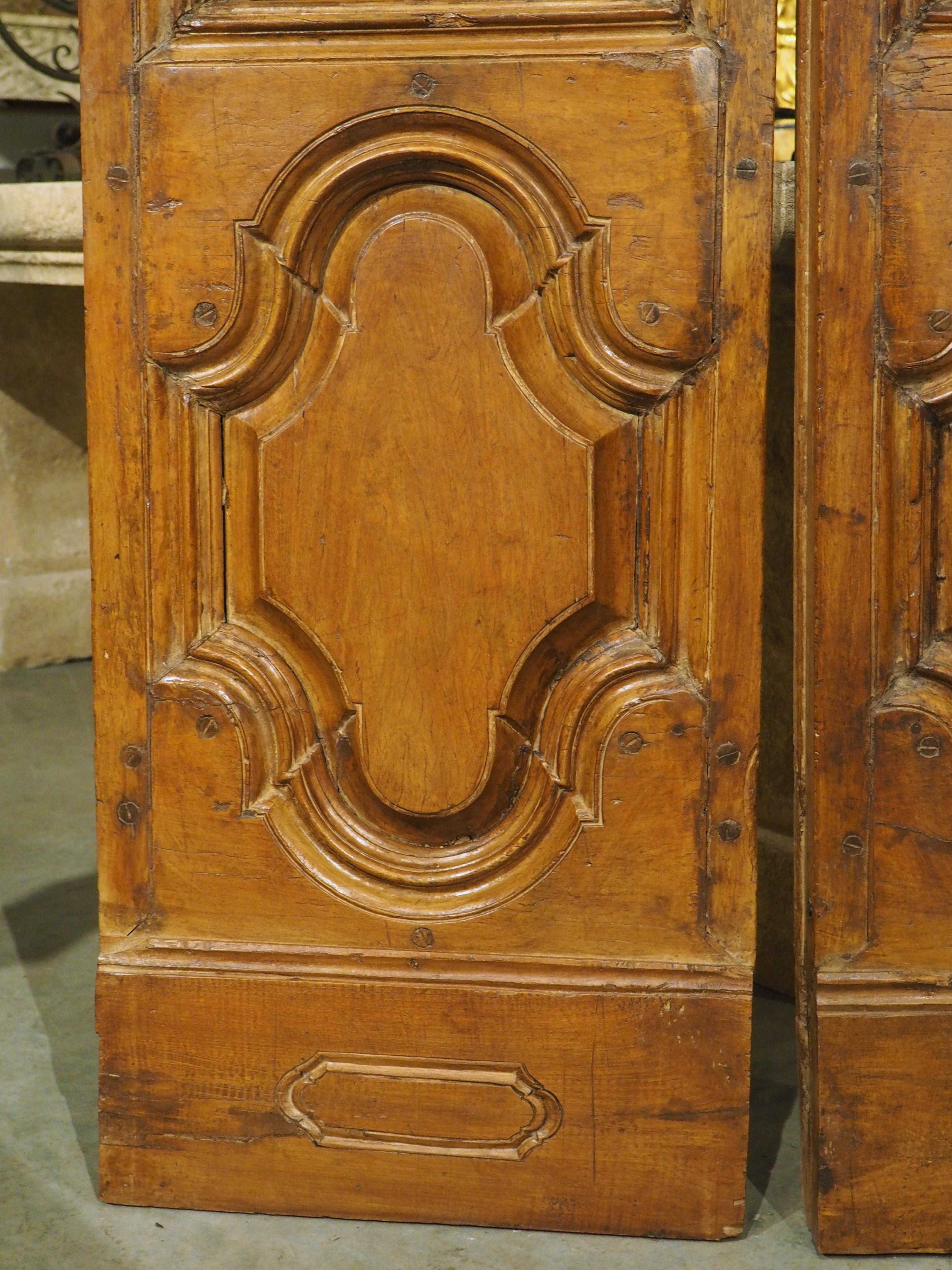 Hand-Carved Pair of Circa 1750 Walnut Wood Entry Doors from Spain For Sale