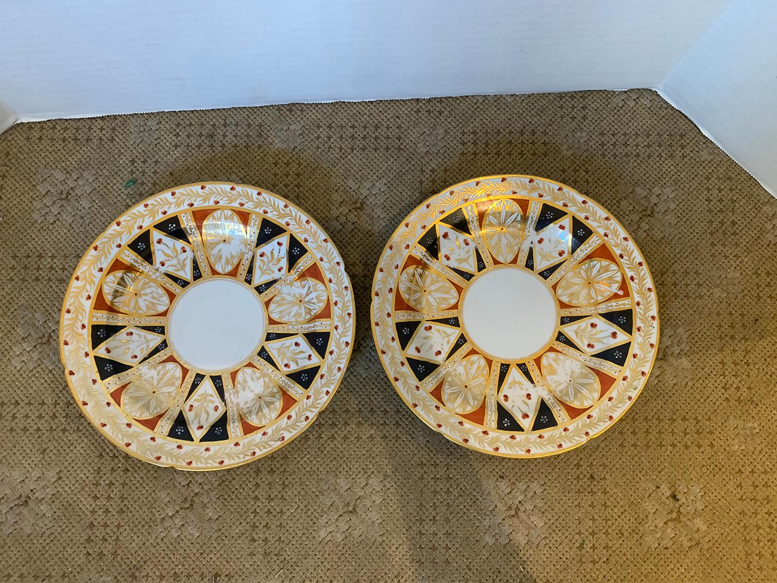 Pair of 19th century circa 1810 English Coalport round porcelain plates with elaborate gilt detailing and old sticker.
