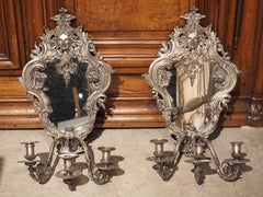 Pair of circa 1850 Régence Style Silvered Bronze Mirrored Sconces from France