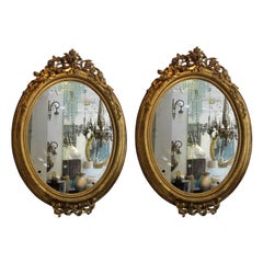 Pair of circa 1860 Large French Napoleon III Large Carved Gilt Oval Mirrors