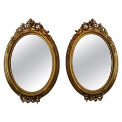 Pair of circa 1860 Large French Napoleon III Large Carved Gilt Oval Mirrors