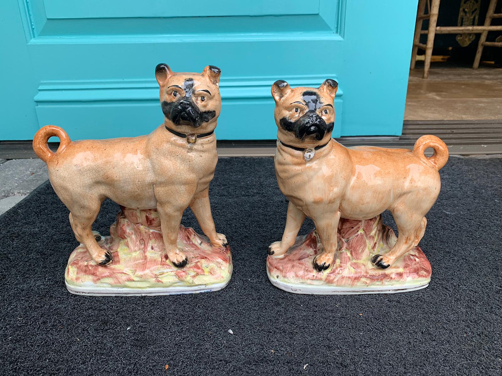 Pair of circa 1860 Staffordshire pottery figures of standing pugs
Measure: One: 7.25