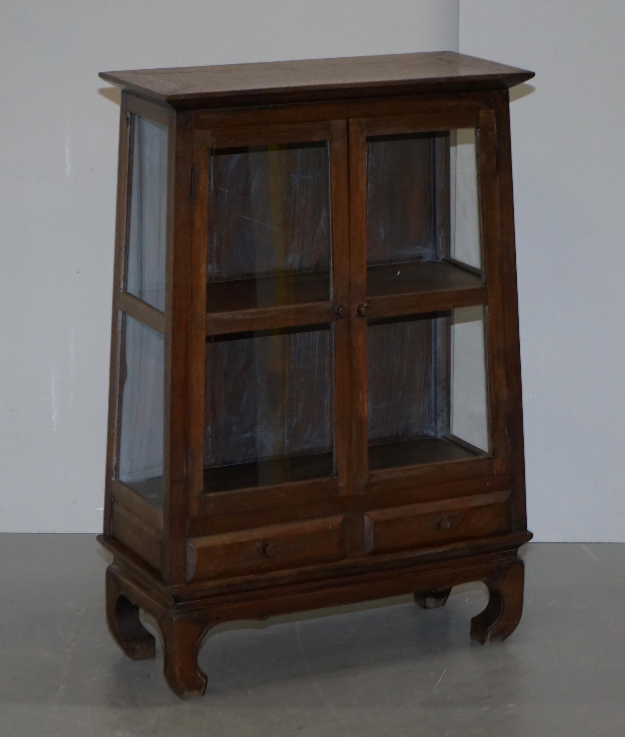 We are delighted to offer for sale this lovely pair of Chinese circa 1900 teak Alter Temple style glazed door bookcases

A good looking well made and decorative pair, they are slightly different heights however its not so much that you notice when