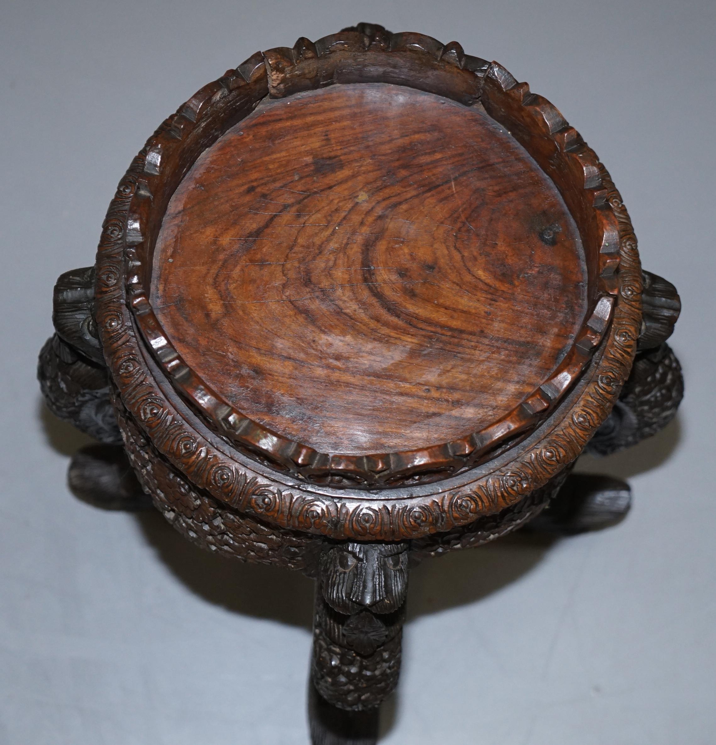 carved wooden plant stand