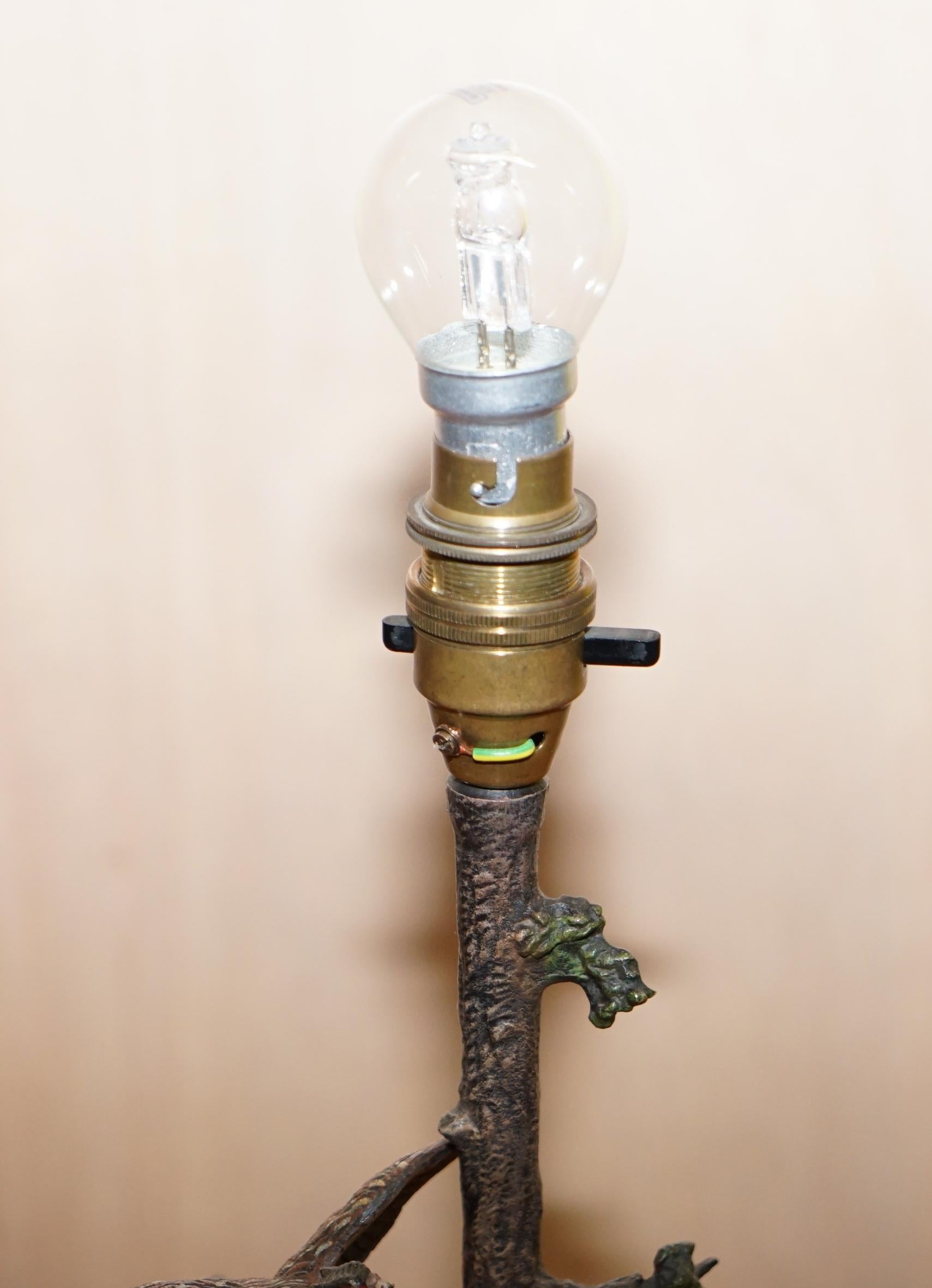 Hand-Crafted Pair of circa 1920 Cold Painted Bronze Lamps of Presents in Trees with Onyx Base