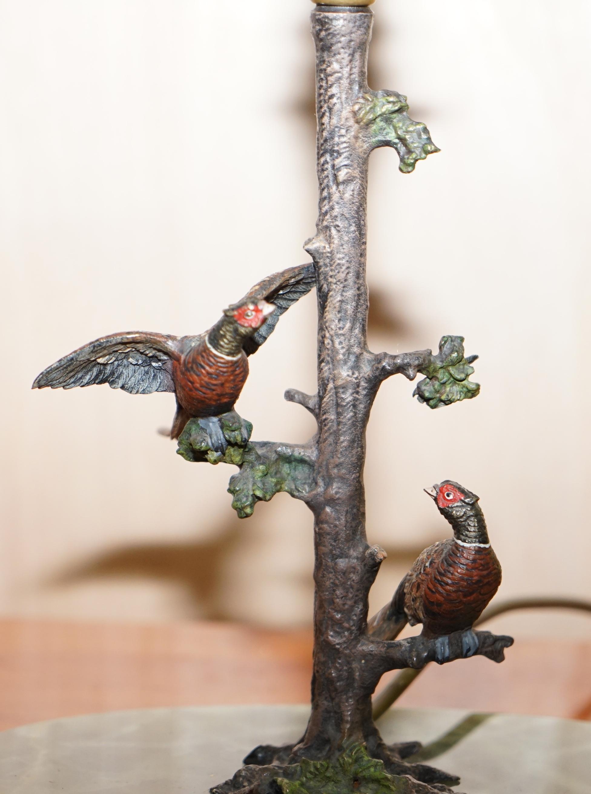 Early 20th Century Pair of circa 1920 Cold Painted Bronze Lamps of Presents in Trees with Onyx Base