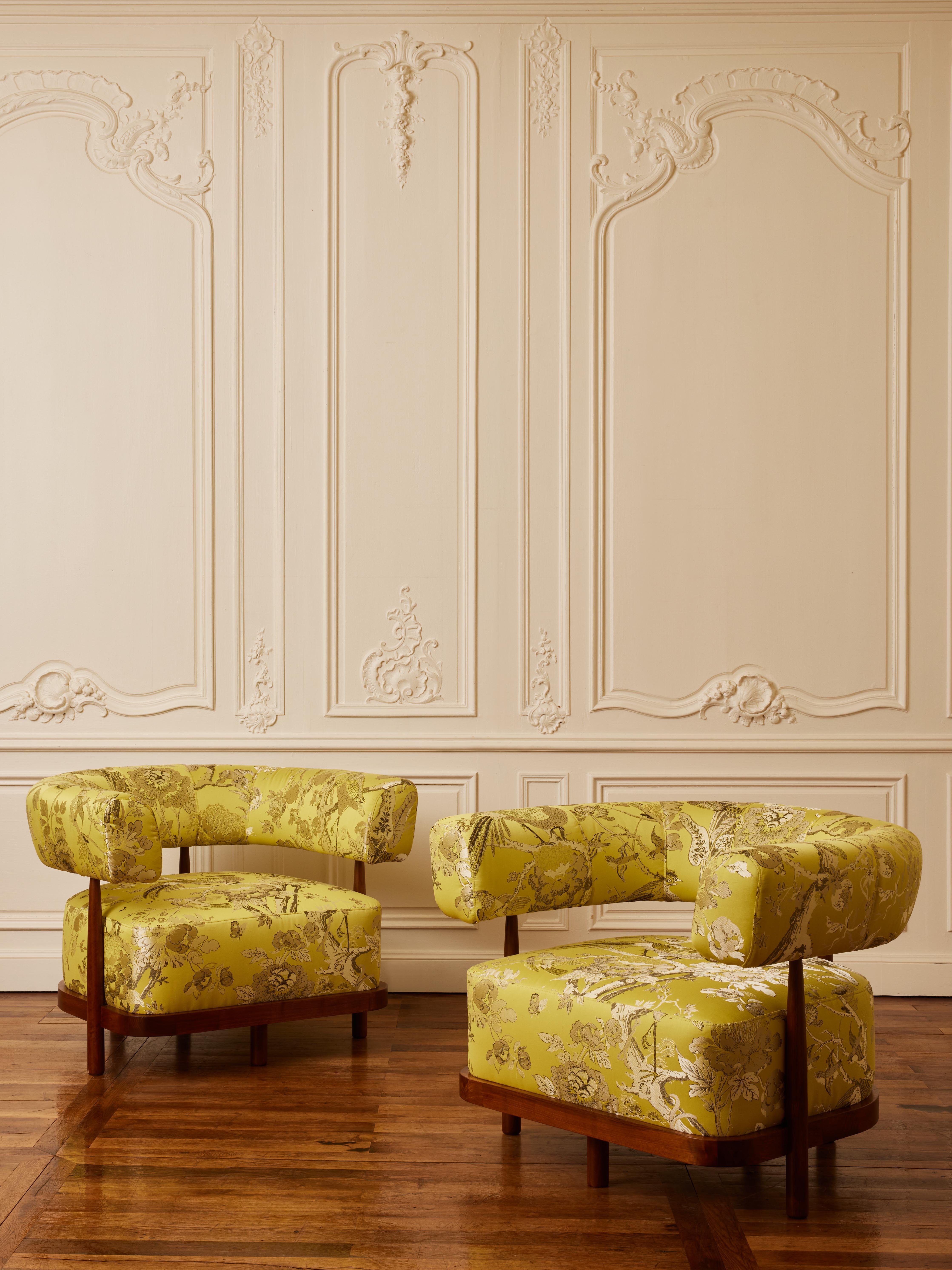 Pair of wooden armchairs with custom reupholstered with a fabric by Dédar.
Creation by Studio Glustin.