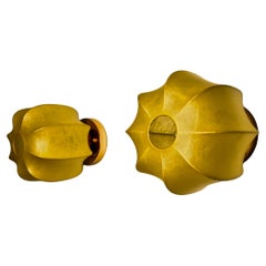Pair of circular "Cocoon" wall lights, resin and pine, Italy, 1970