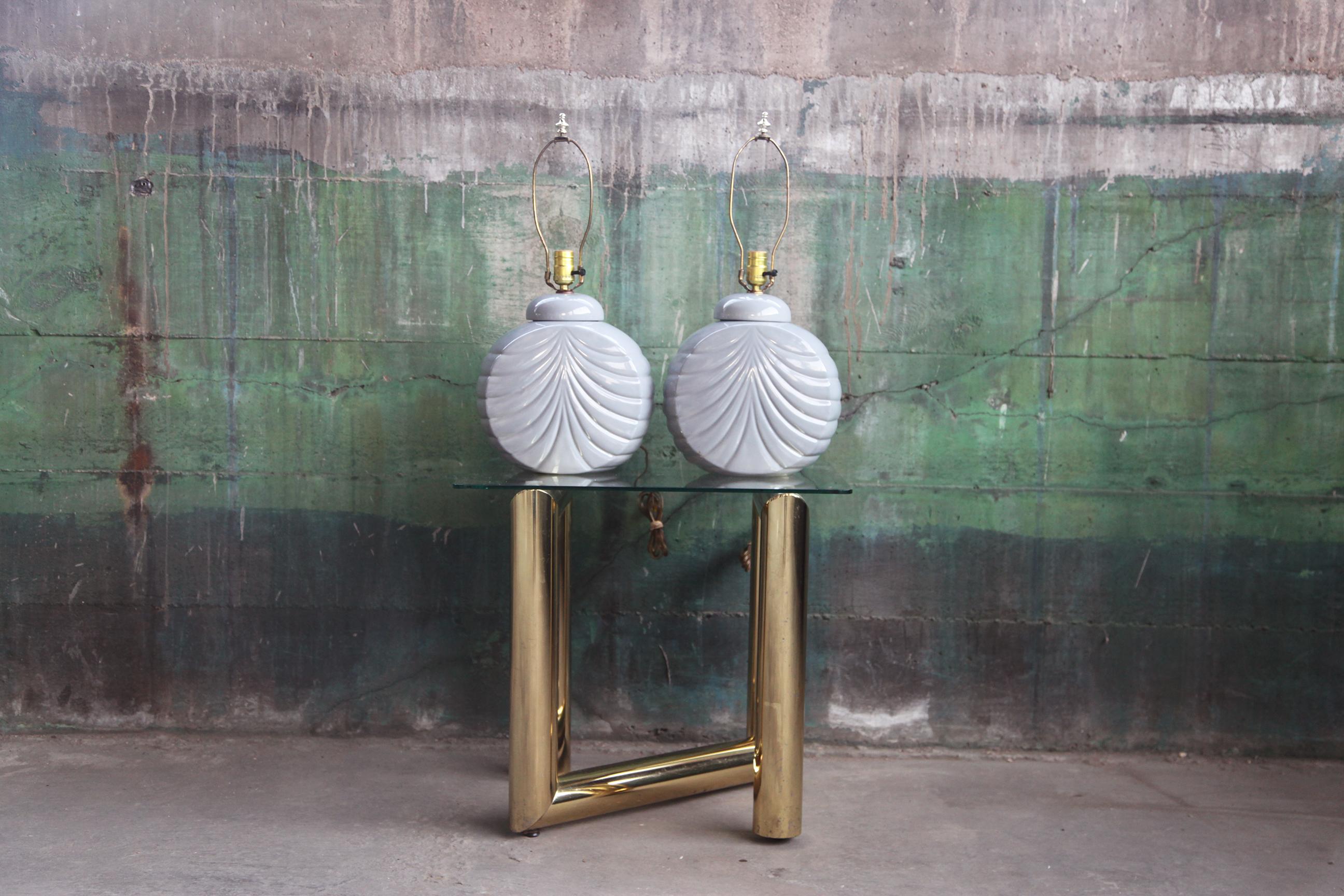 Very incredible pair of 1980s ceramic table lamps in elephant gray.
Sculptural, bauhaus shaped, in the manner of Hollywood Regency meets Memphis Milano.
Extremely unique and stylish!

Shown here with standard vintage off white lamp shades.  You can