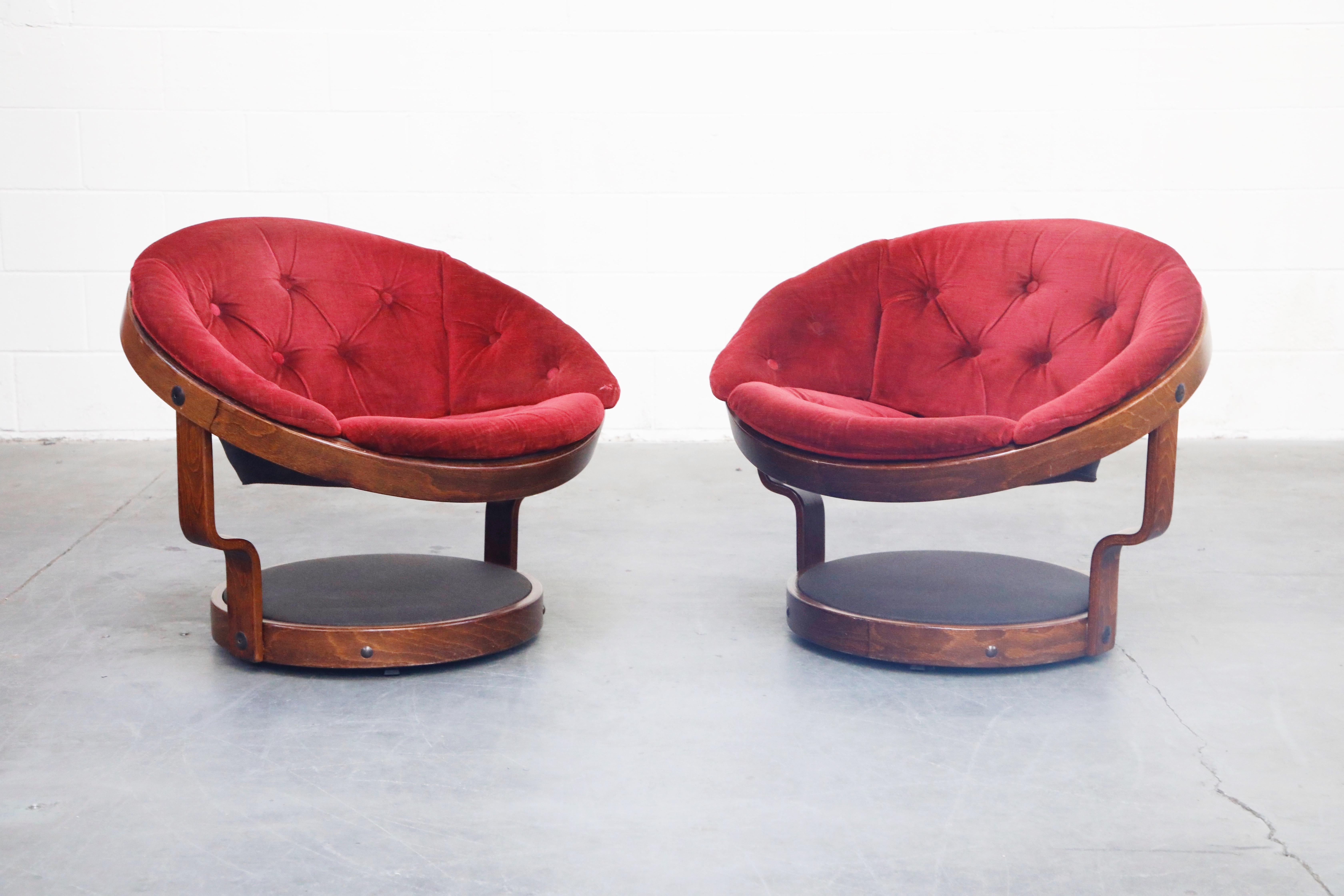 This beautiful pair of swivel lounge chairs by Oddmund Vad for VAD Trevarefabrikk, featuring a floating circular bentwood frame and red soft fabric tufted cushions. Signed under the base with labels, as see in photographs. This rare 1970s design is