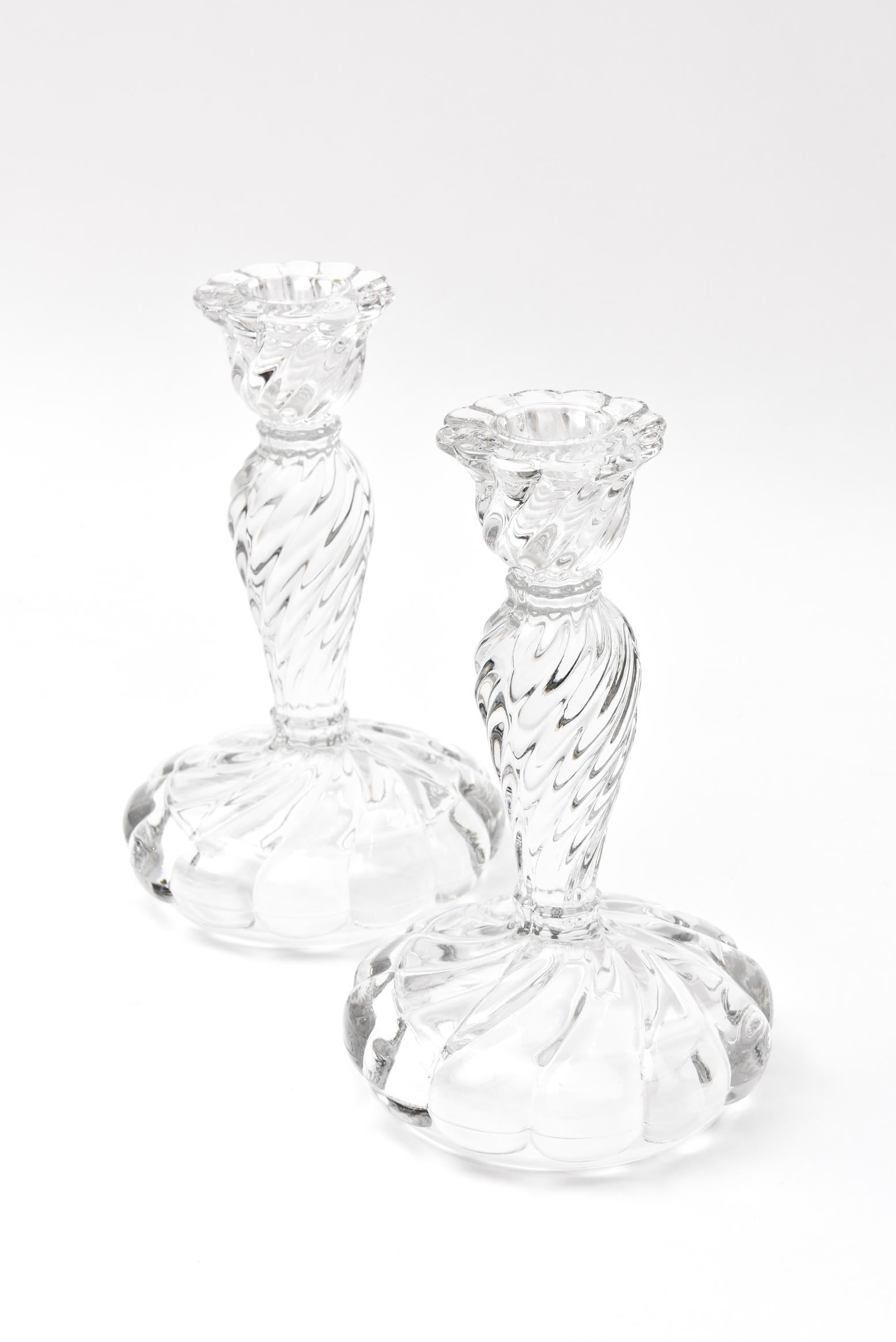 A nice set of antique crystal candleholders featuring a full swirl design with nice proportions. Very nice antique condition.