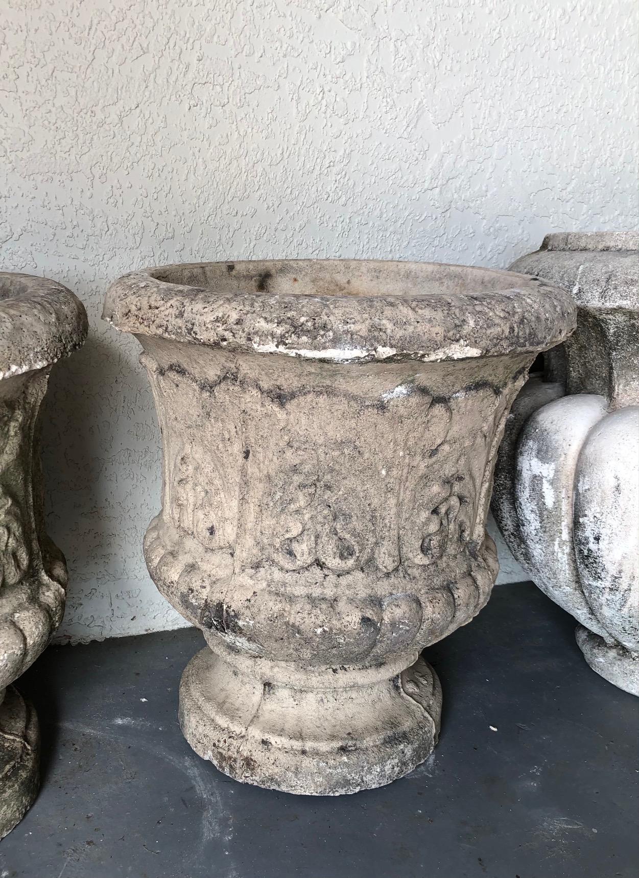 19th century pair of French concrete garden urns with decorative acanthus leaves on base, each drilled for proper water drainage.
#5217.
 