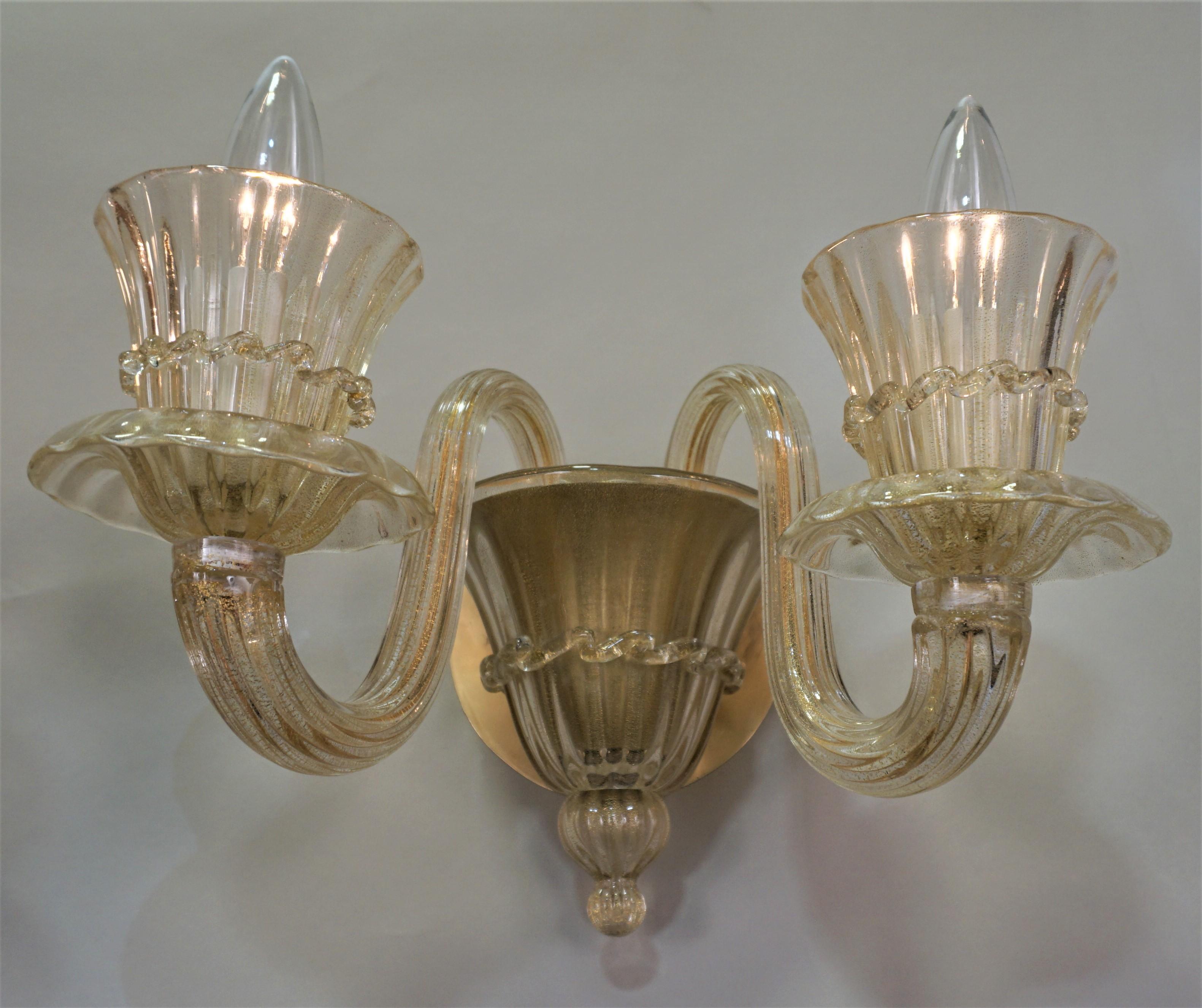 Beautiful double light golden Murano blown glass wall sconces.