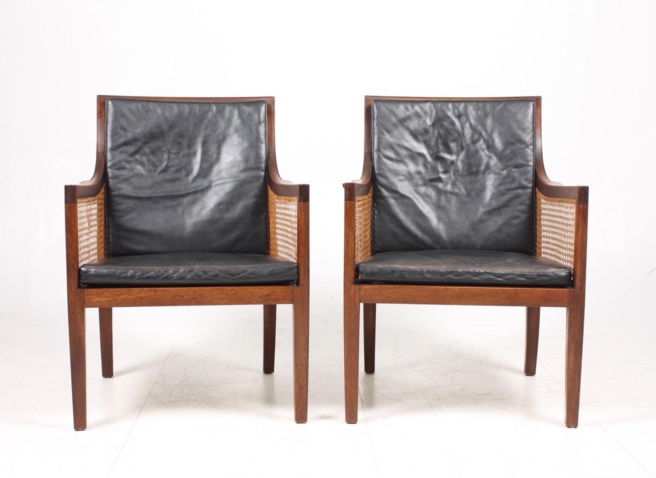 Danish Pair of Classic Lounge Chairs in Mahogany and French Cane, Made in Denmark 1940s