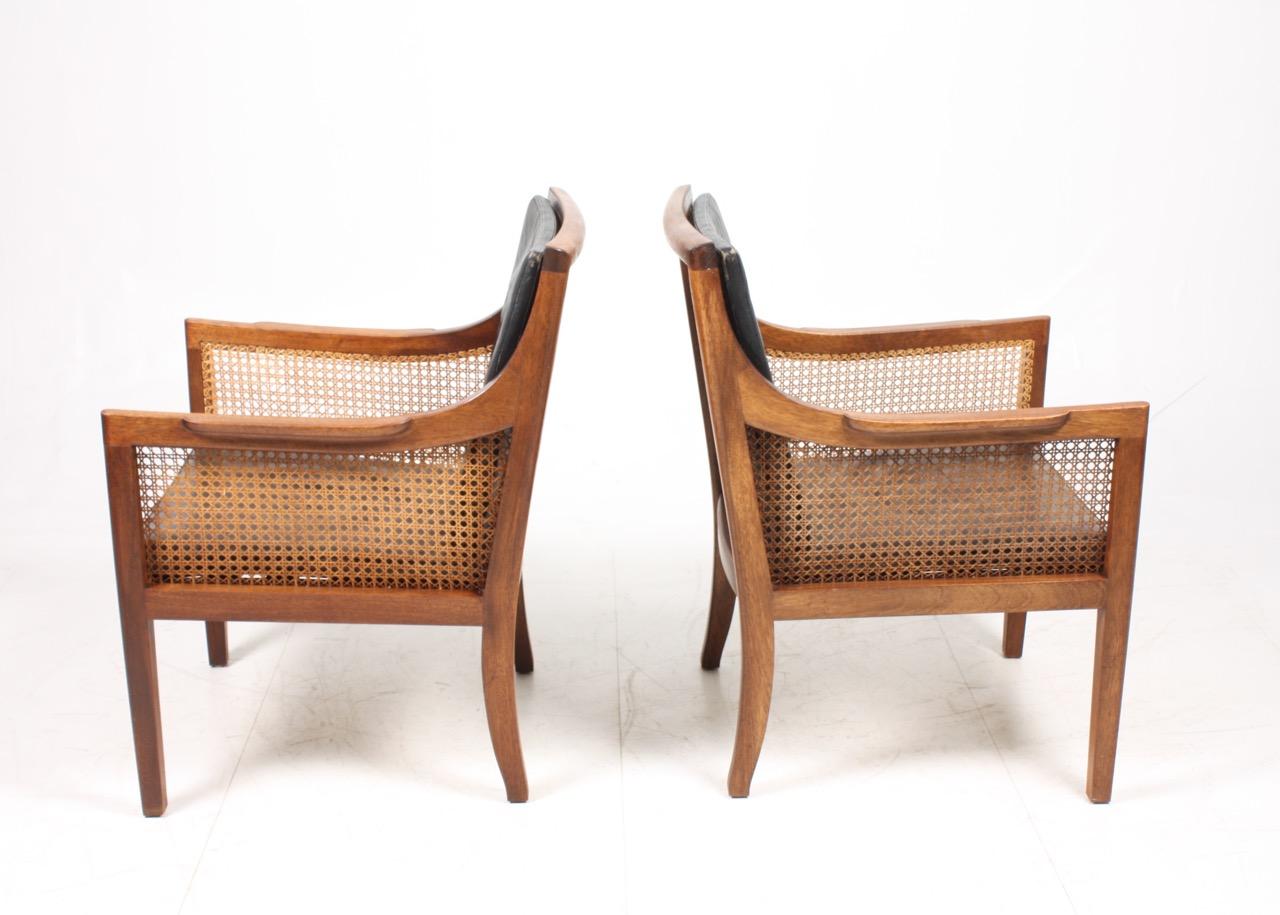 Pair of Classic Lounge Chairs in Mahogany and French Cane, Made in Denmark 1940s 1
