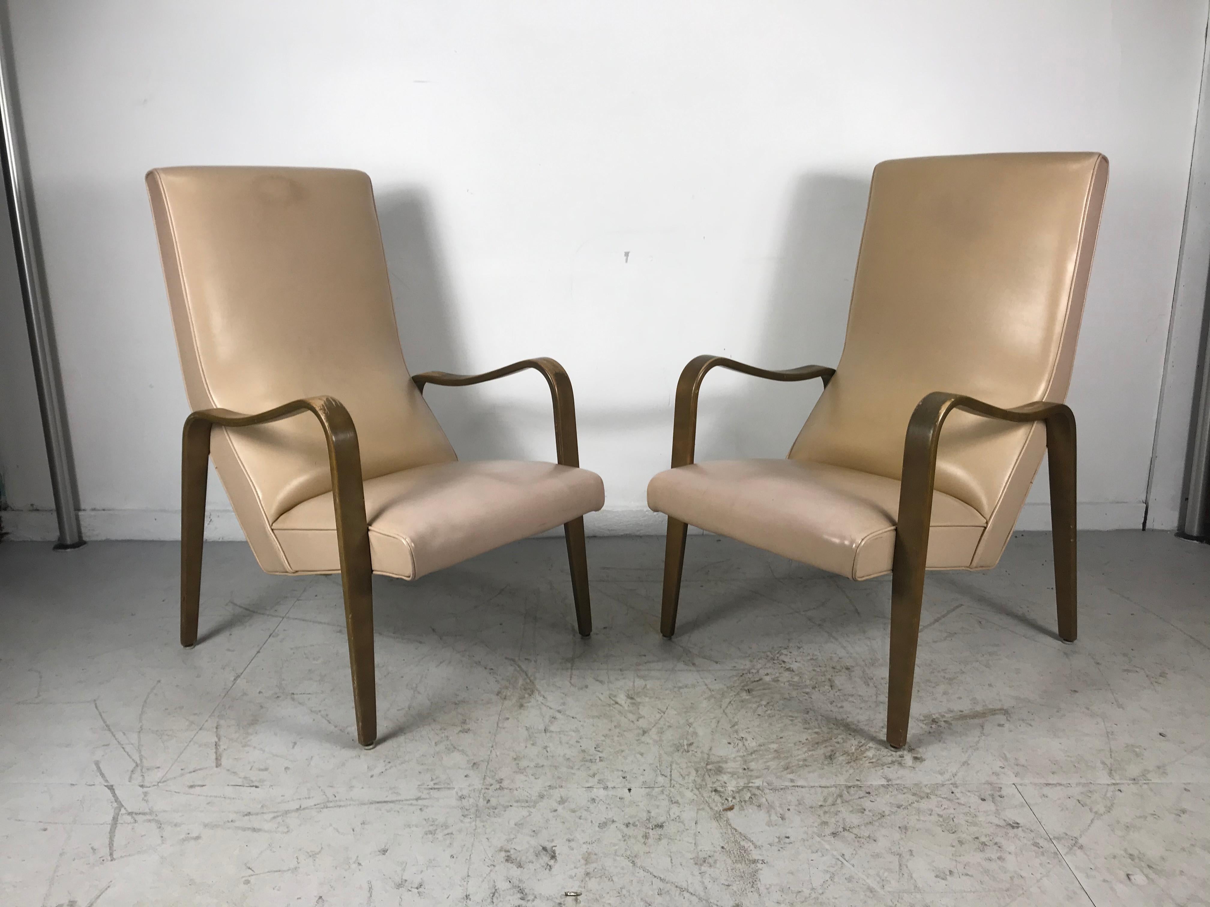 Pair of Classic Mid-Century Modern bentwood lounge chairs by Thonet, stunning lines, extremely comfortable, rare high back version, retain original finish, well worn finish, leaving it up to the buyers discretion, refinish, lacquer etc? Would be