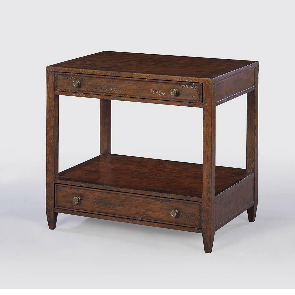 Classic nightstand - A wide rectangle side table with two drawers, brass hardware, and tapered feet, with a “country” dark mahogany tone with natural highlights, a hand-rubbed and distressed antiqued finish.

Dimensions: 28