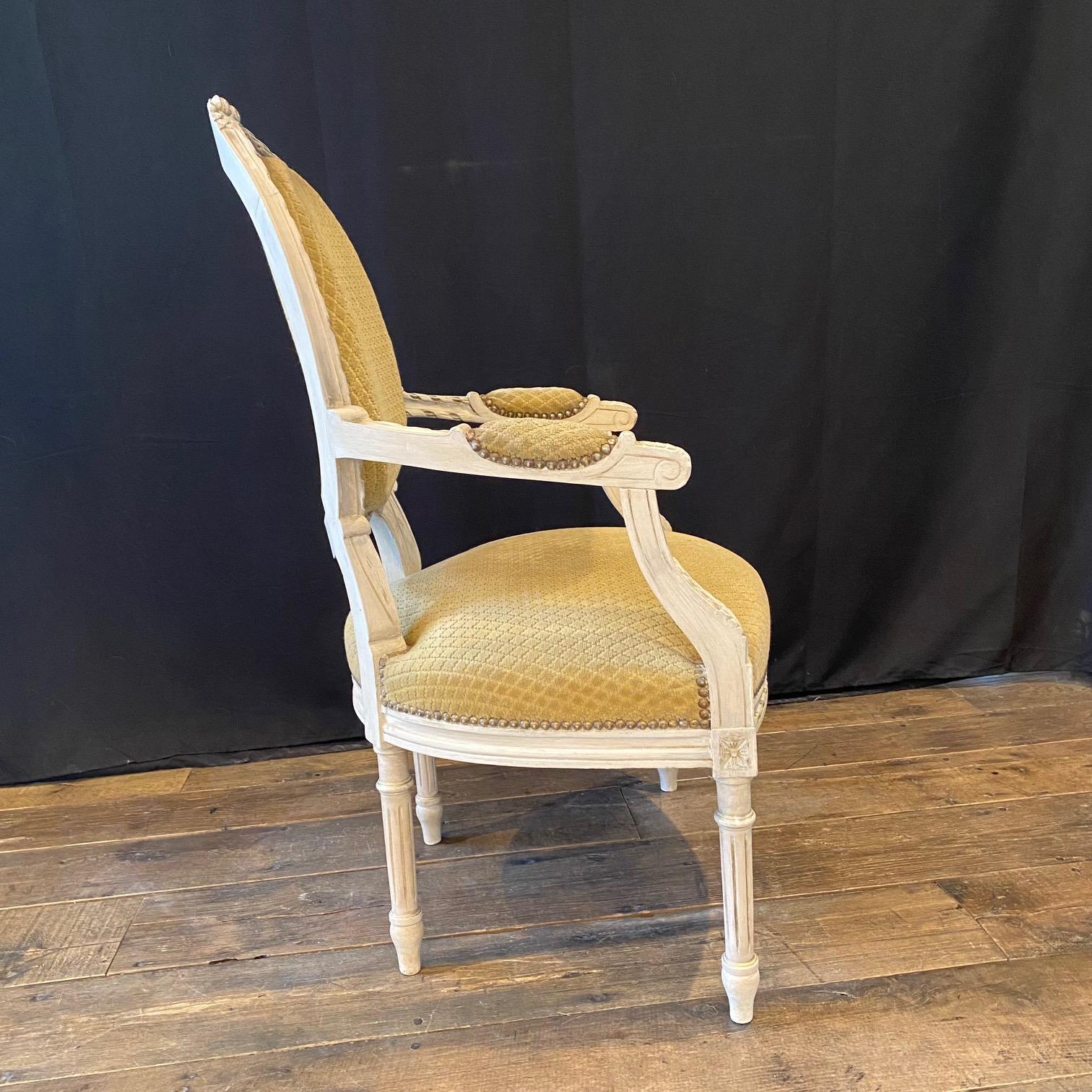 Upholstery Pair of Classic Painted French Carved Louis XVI Arm Chairs or Fauteuils