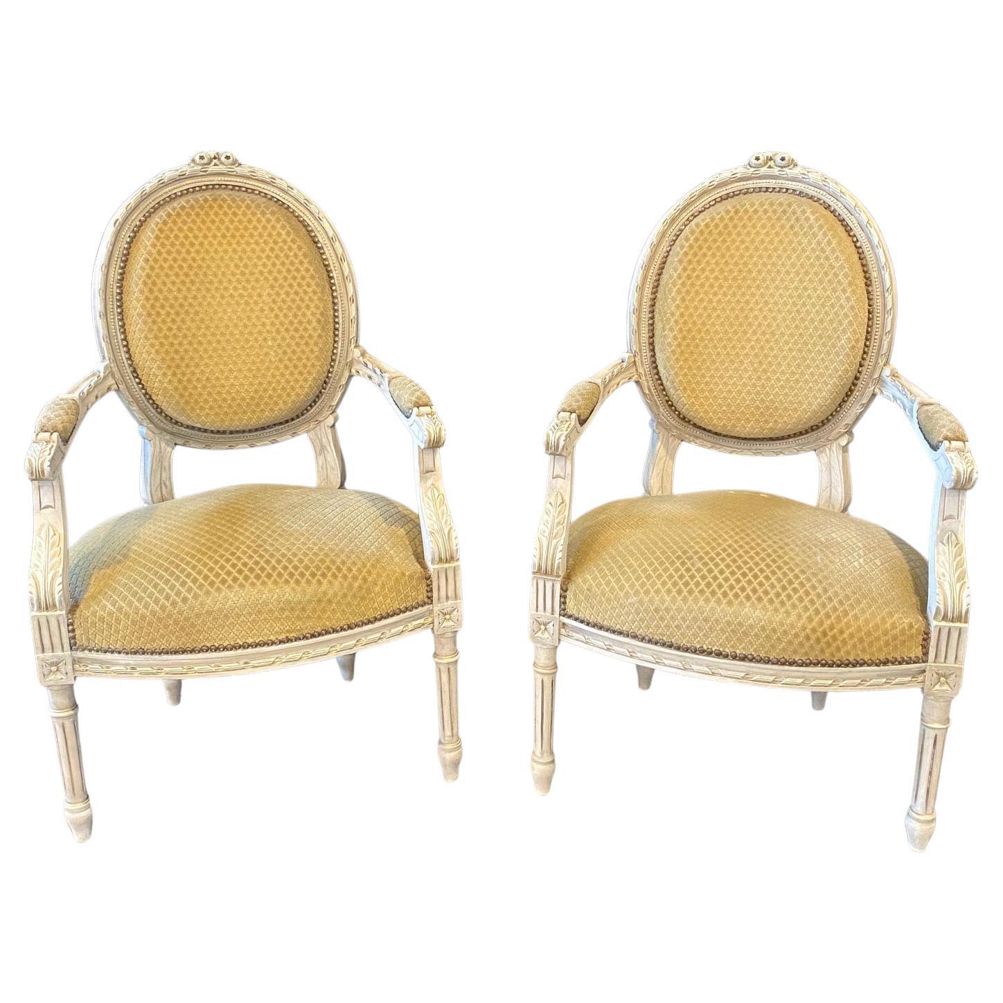 Pair of Classic Painted French Carved Louis XVI Arm Chairs or Fauteuils