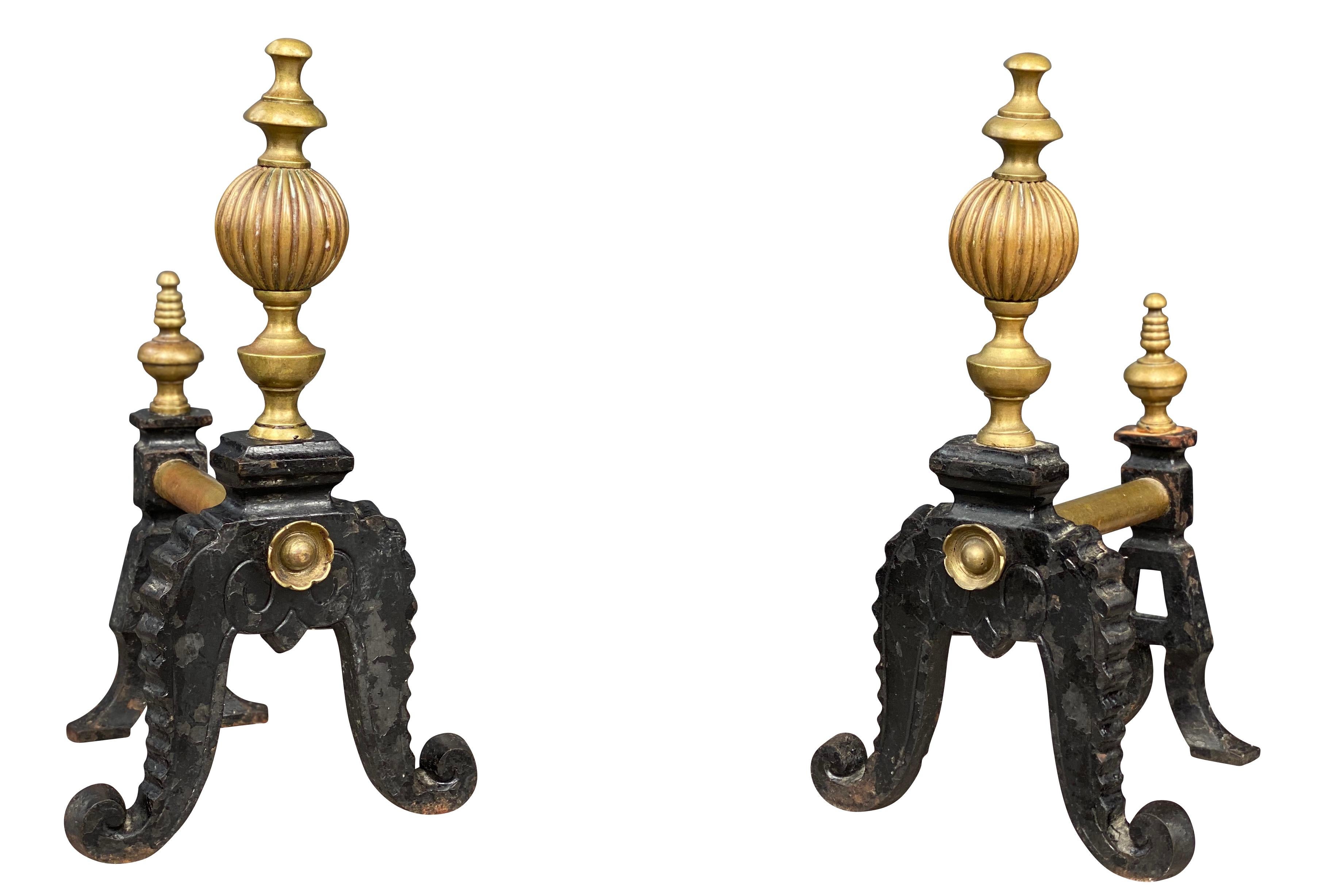 Each with urn finials and octopus legs.