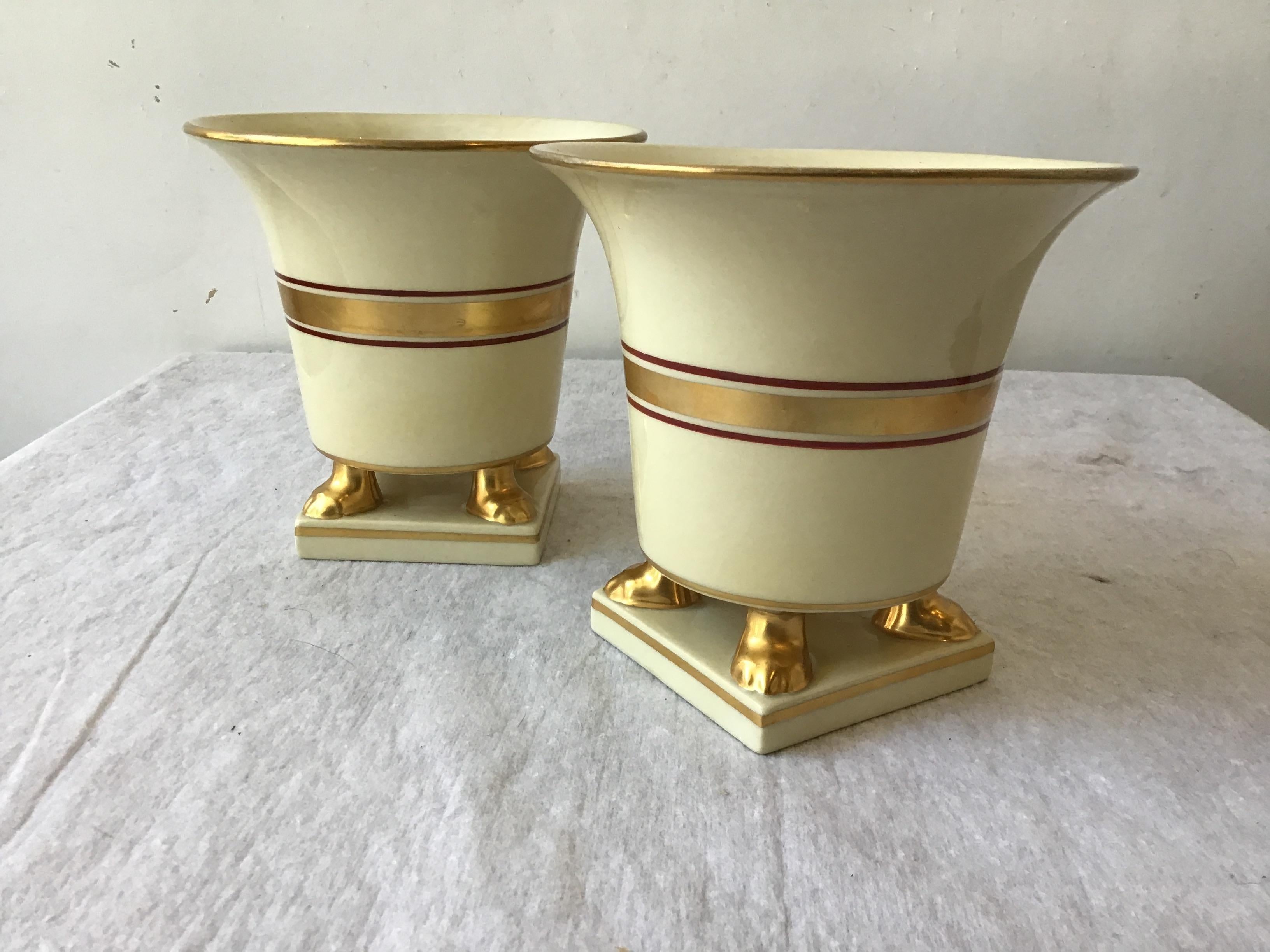 Pair of classical ceramic cache pots. Gilt accents.