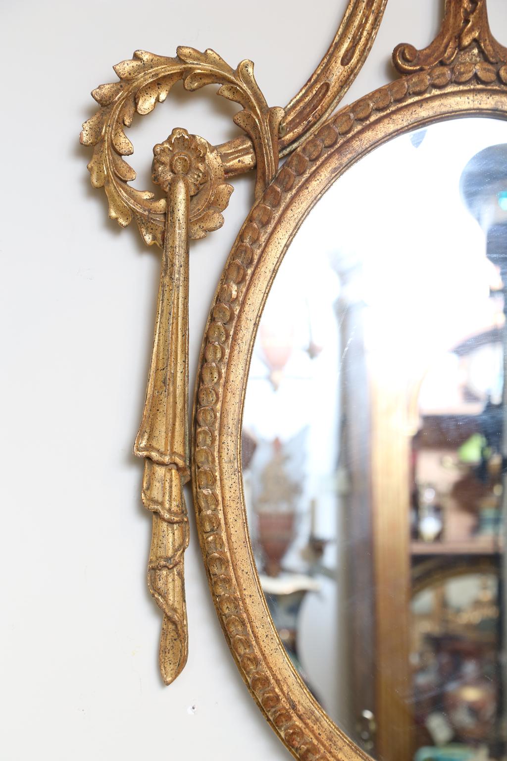Pair of Classical-form Italian Carved Giltwood Oval Mirrors In Good Condition In West Palm Beach, FL