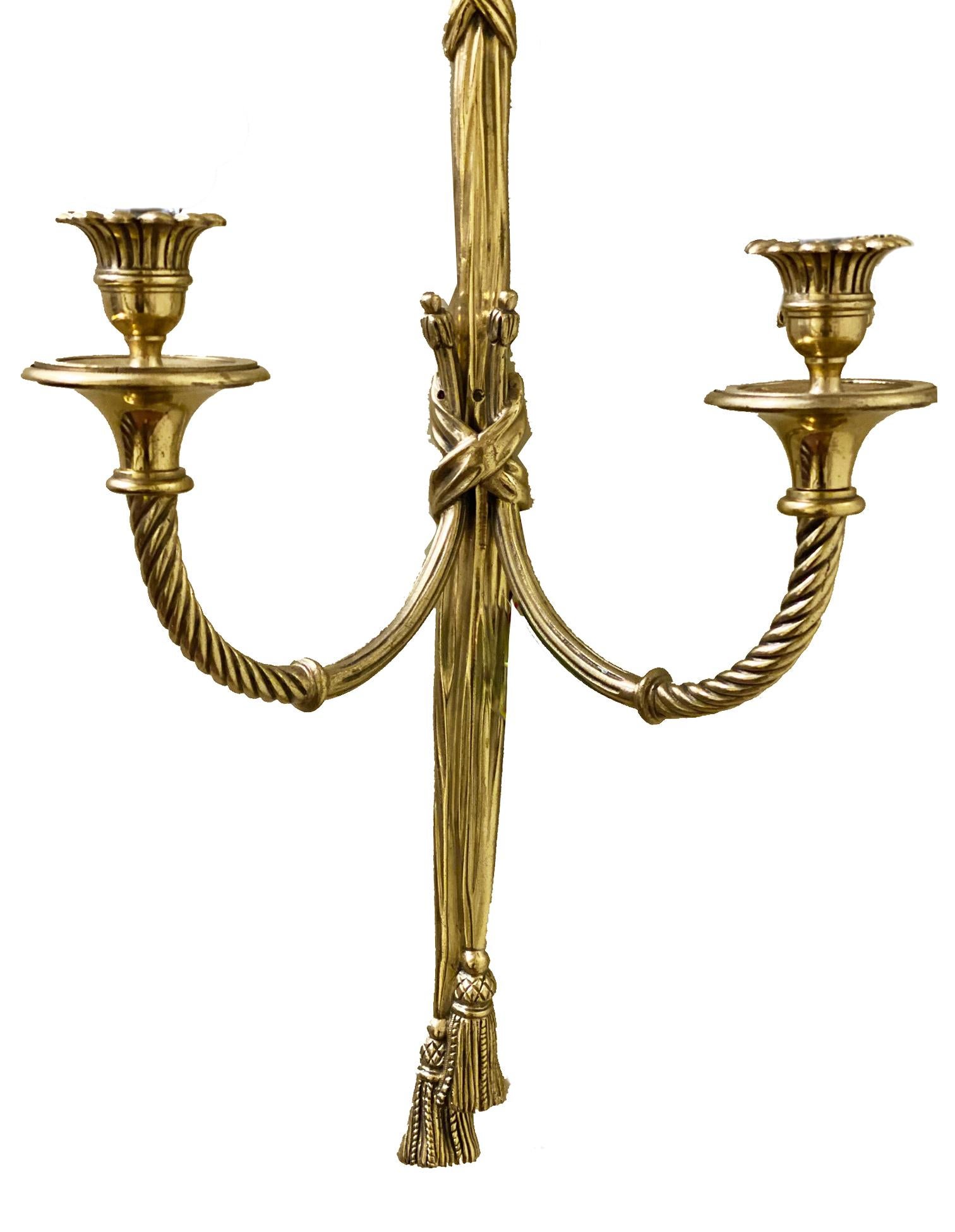 Polished Pair of classical French ormolu Louis XVI style two branch wall lights For Sale