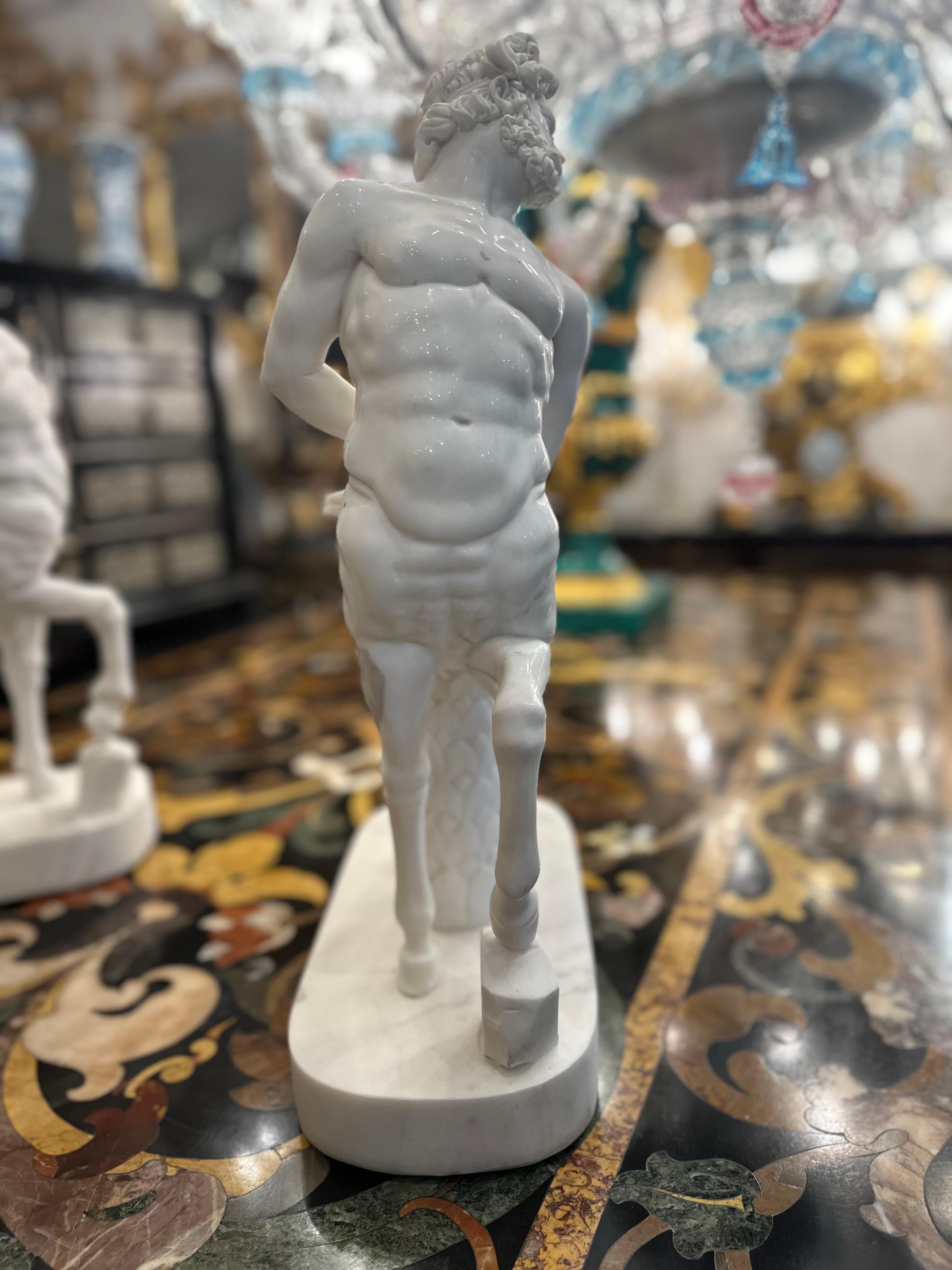 A wonderfully decorative pair of marble classical Greek style Centaurs. The polished marble is skilfully carved with intricate detailing to the the figures faces, muscles and pose. Rippled muscles are flexed, the hair is softly curled and their