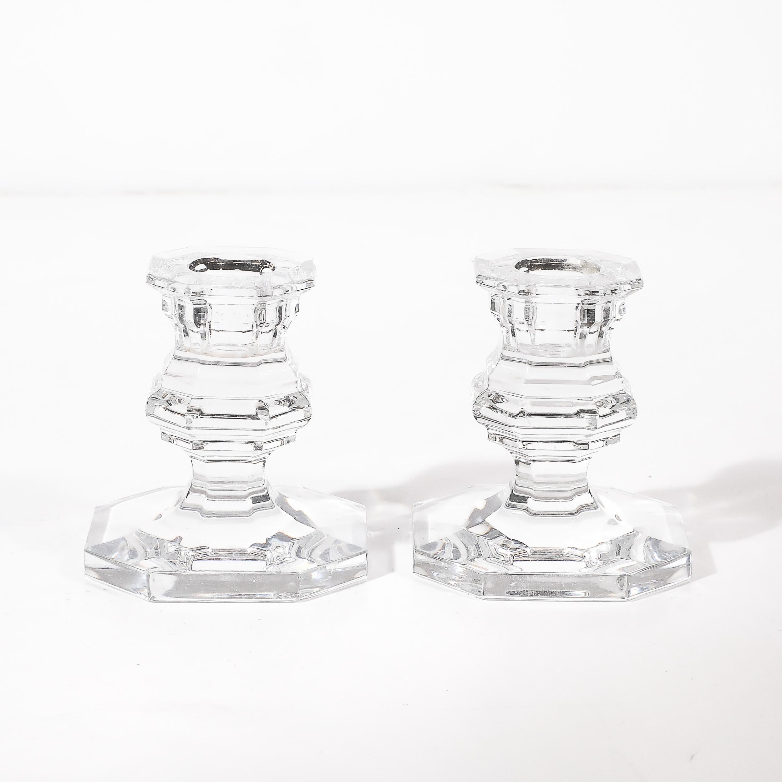 This refined pair of Regence-style crystal candlestick holders, crafted by the legendary French crystal maker Baccarat, exemplifies timeless elegance and fine craftsmanship. Designed in the Regence style, these candlesticks feature clean, classical