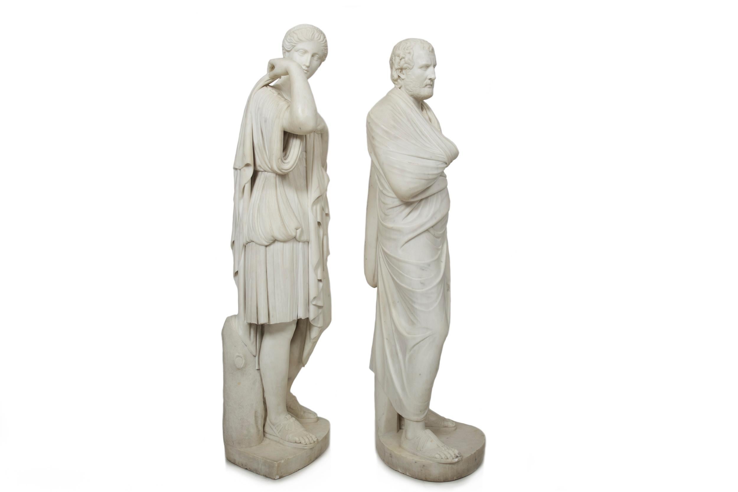 An incredibly fine and rare pair of full-length Classical statues of the goddess Artemis and the Greek orator Aeschines, both sculpted to be presented as a matched pair. Note the exquisite translucent Cararra marble with its soapy and silky texture,
