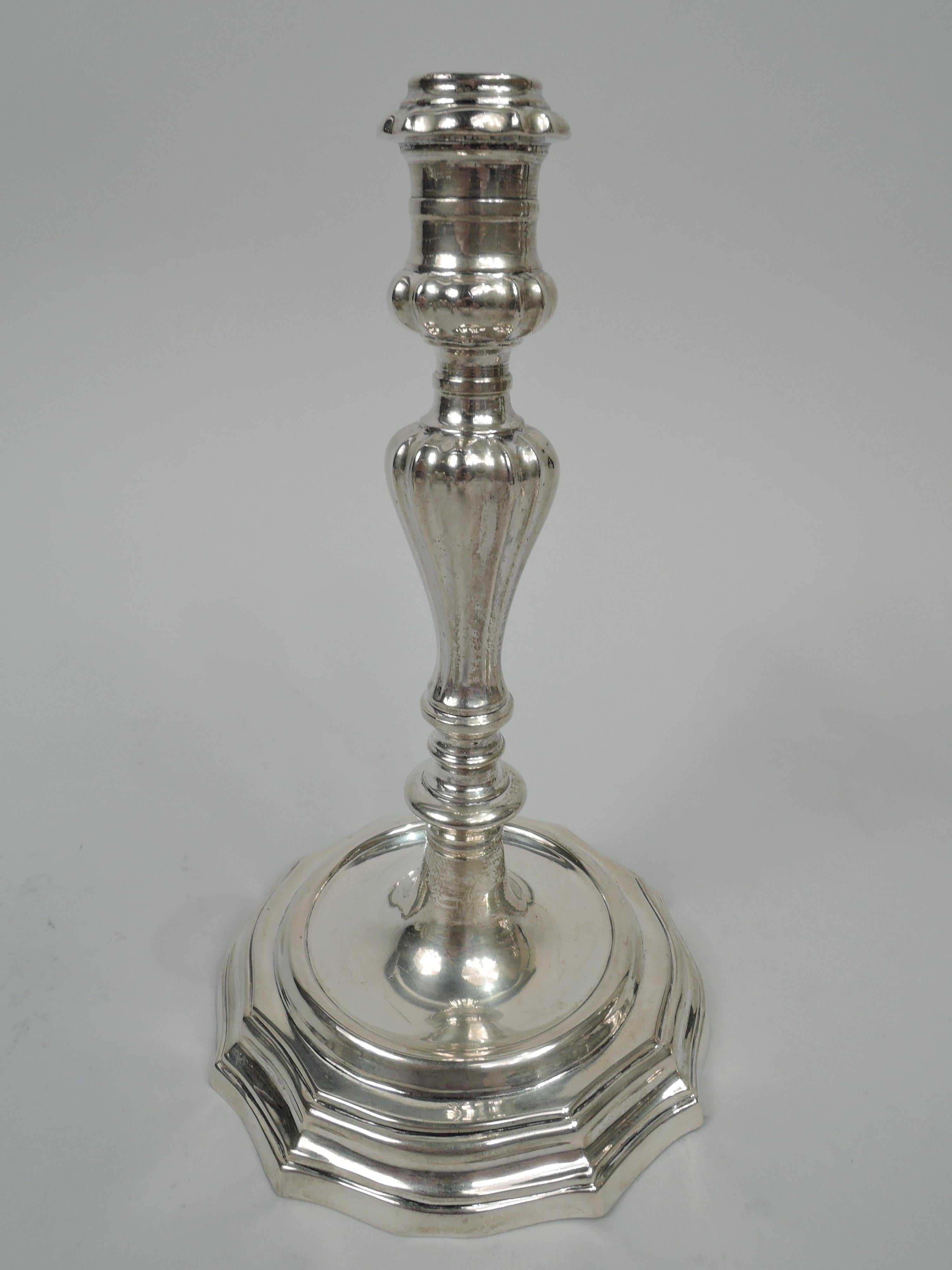 Pair of Italian classical silver candlesticks, circa 1775. Each: banded campana socket on same spool support mounted to knopped baluster shaft stepped and shaped round foot. Fluting and lobing. On foot rim are city stamp (Florence), assayer’s stamp