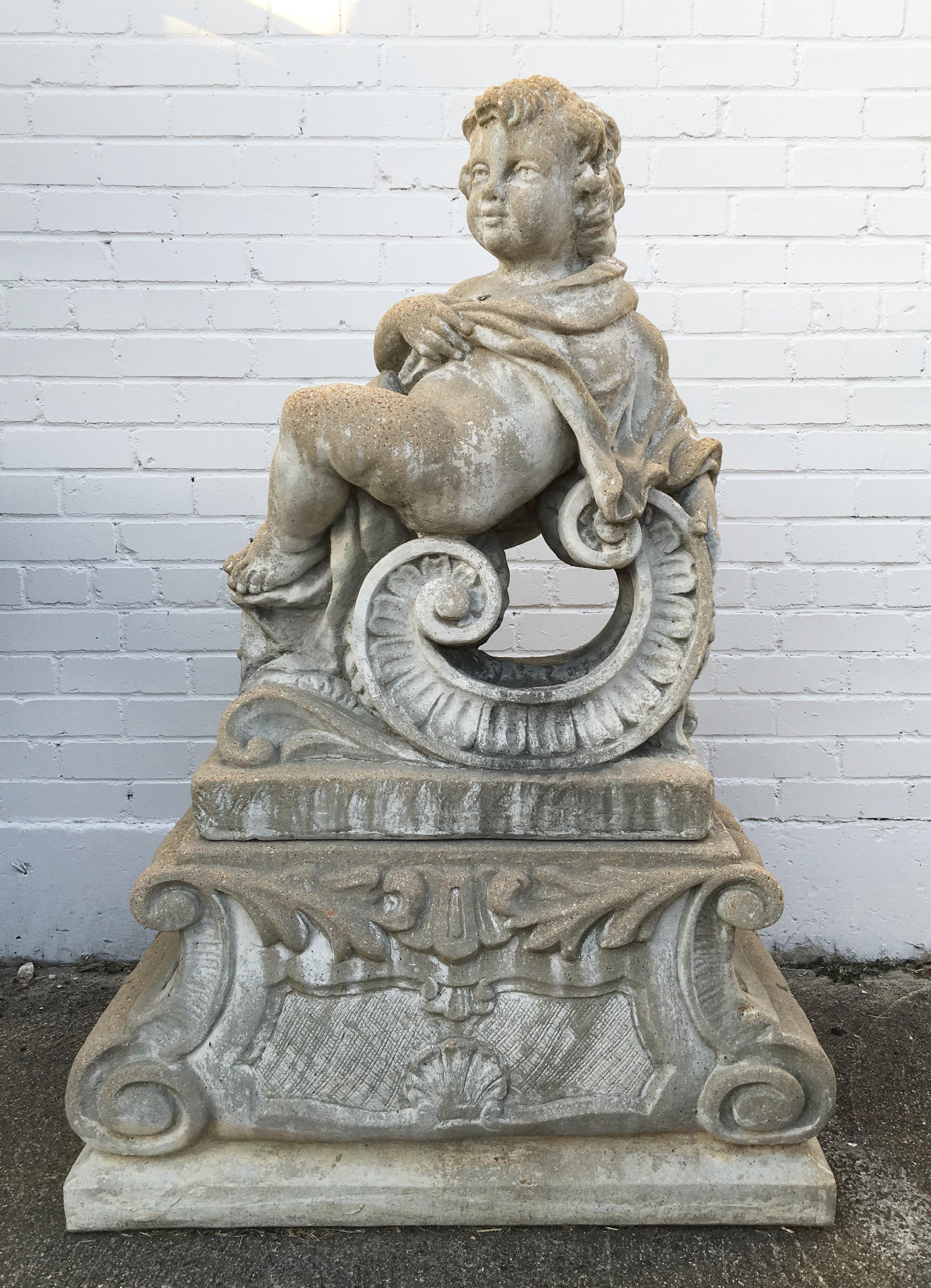 Classical garden statue of putti representing two of the Four Seasons. The stone composite statues, figures depict a cherub with textured curly hair, large eyes with rounded cheeks and naked body draped in cloth for the winter and holding the roses