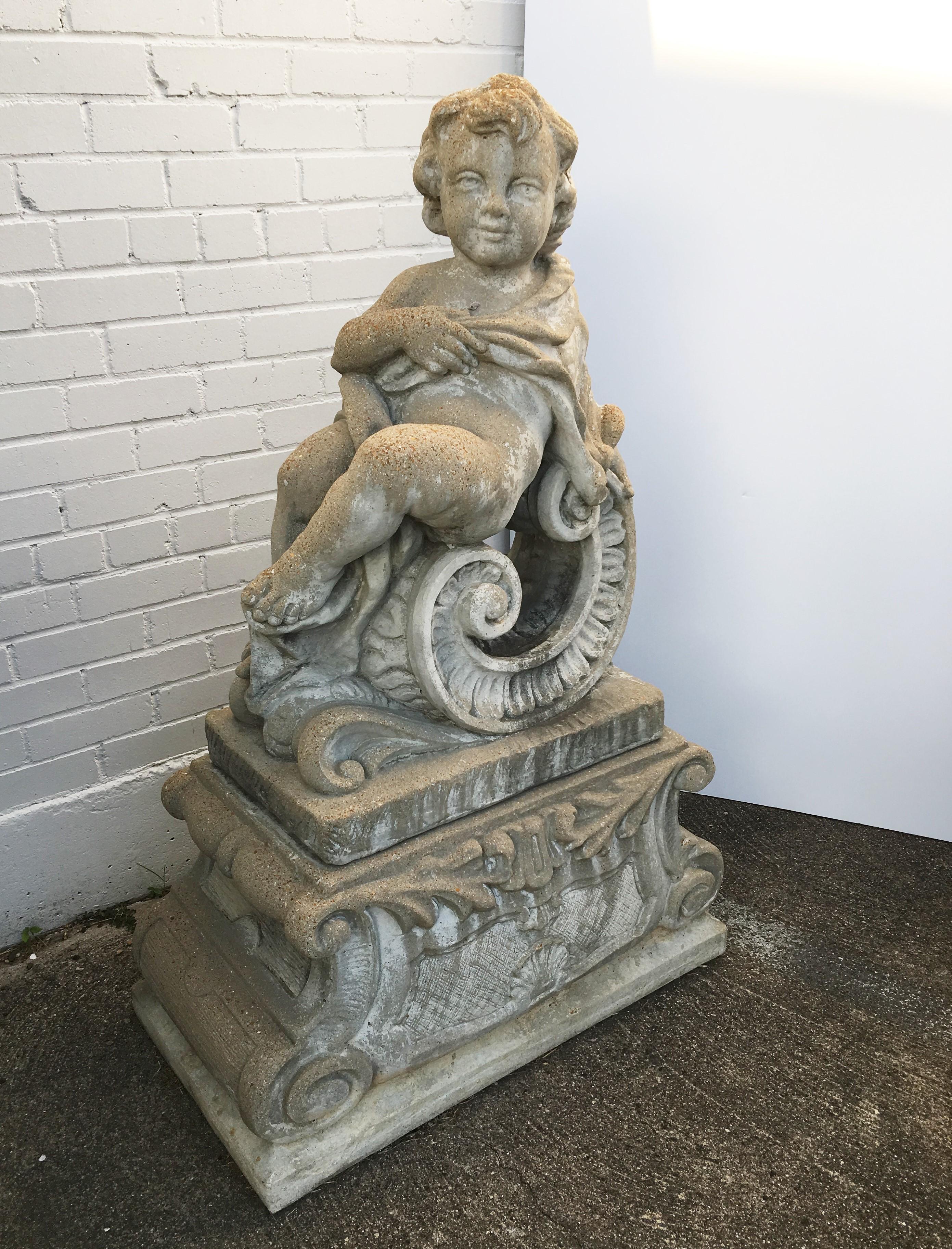 Pair of Classical Stone Composite Putti Garden Statues Holding Roses and Cloth In Good Condition For Sale In Dallas, TX