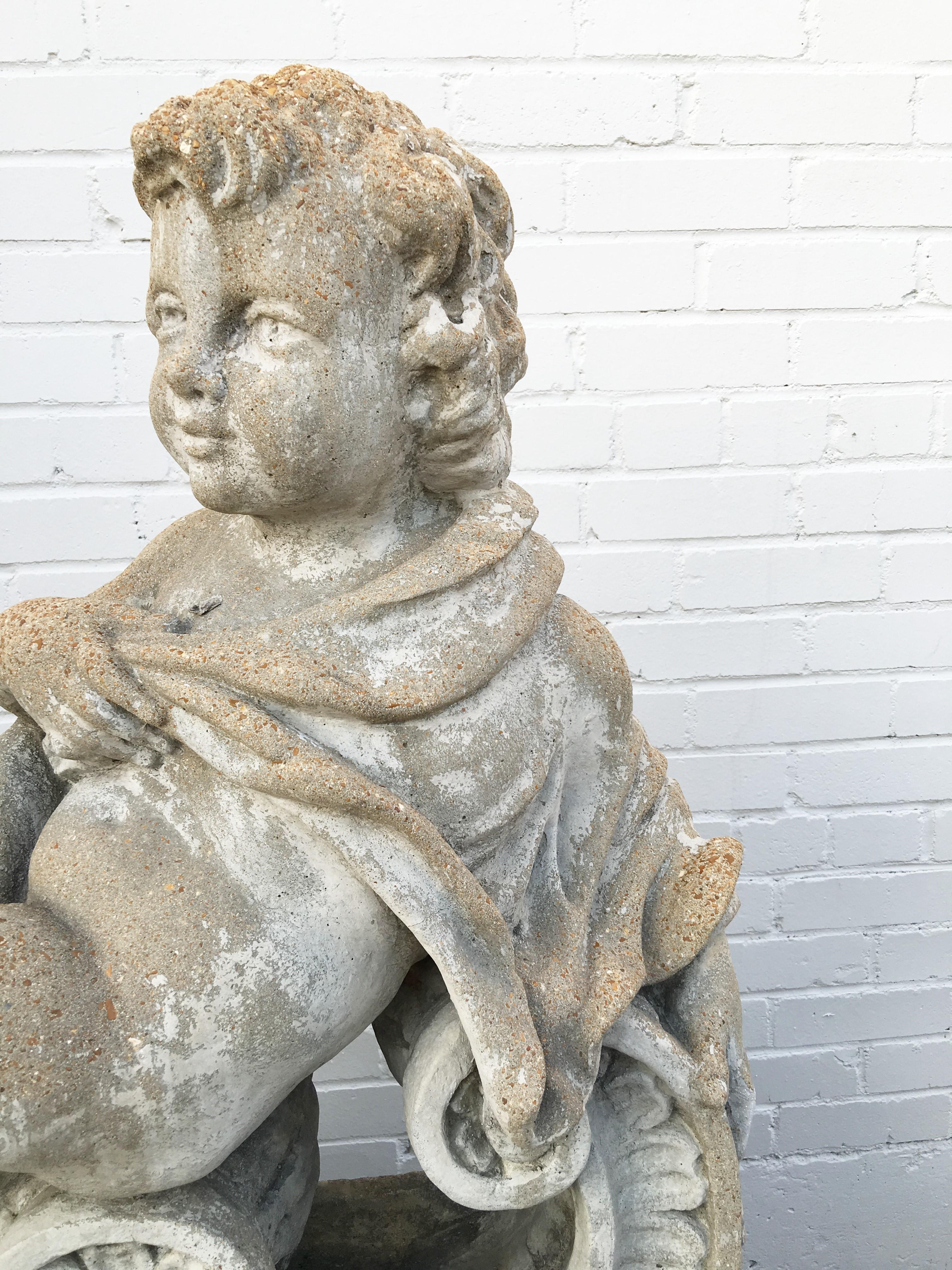 20th Century Pair of Classical Stone Composite Putti Garden Statues Holding Roses and Cloth For Sale