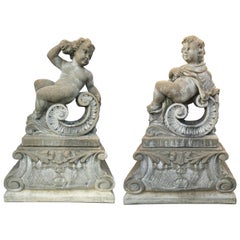 Used Pair of Classical Stone Composite Putti Garden Statues Holding Roses and Cloth