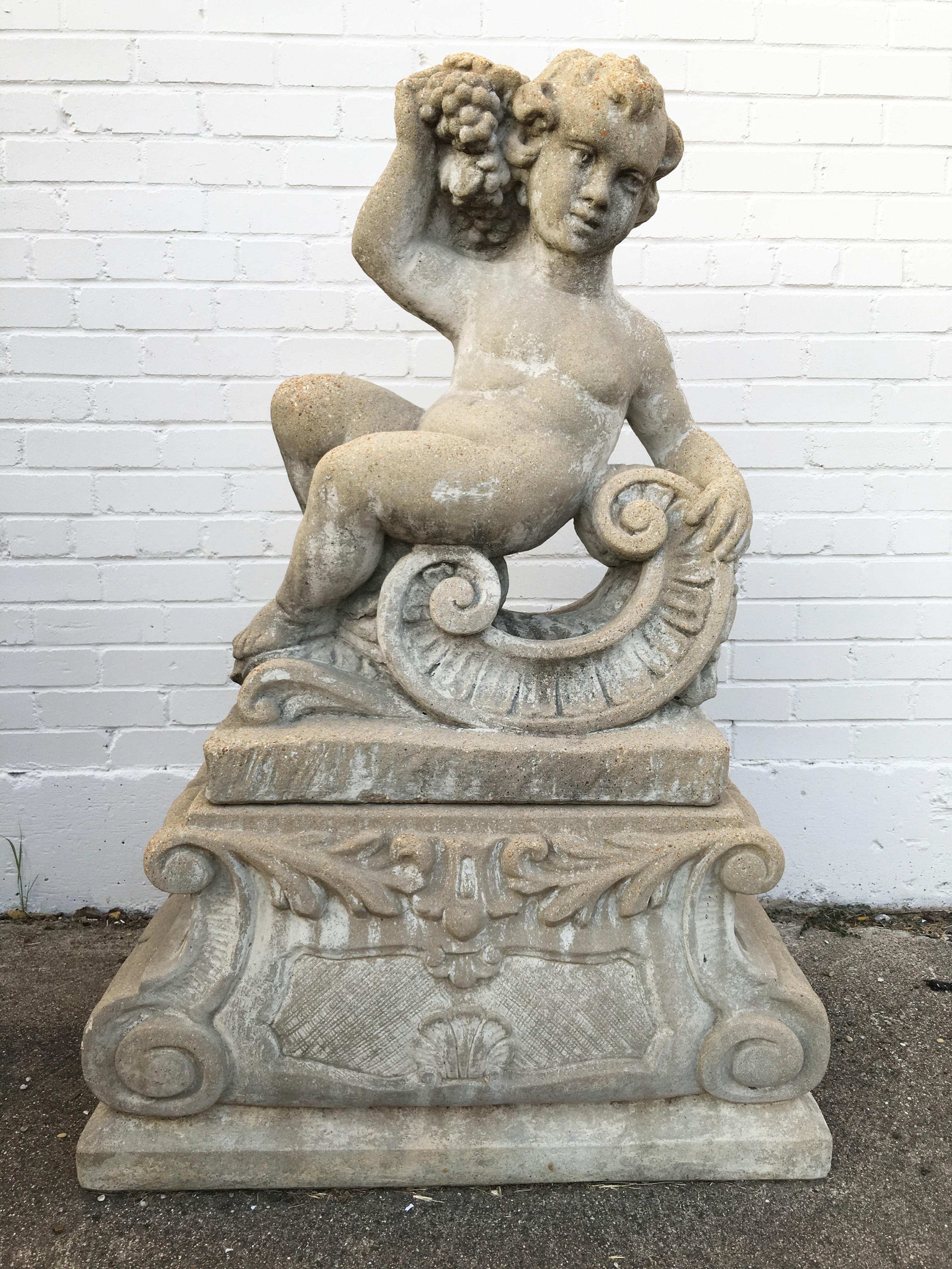 Pair of Classical Stone Composite Putti Garden Statues Holding Wheat and Grapes In Good Condition For Sale In Dallas, TX