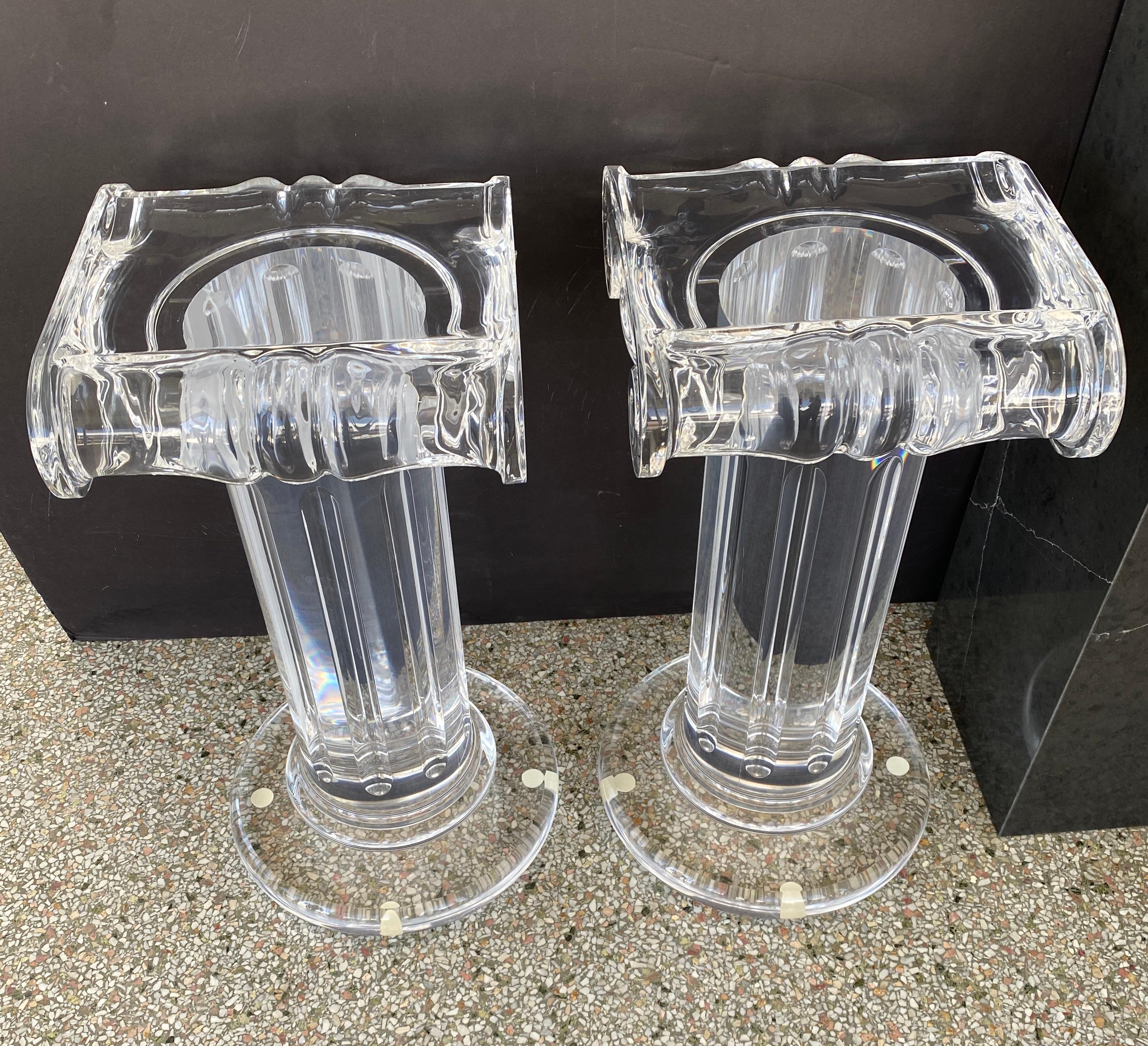 This stylish and chic pair of lucite pedestals with fluted columns and doric capitals can be used to display a piece of sculpture, or perhaps as a base to a console or dining table.

Note: We have had the pieces professionally polished.