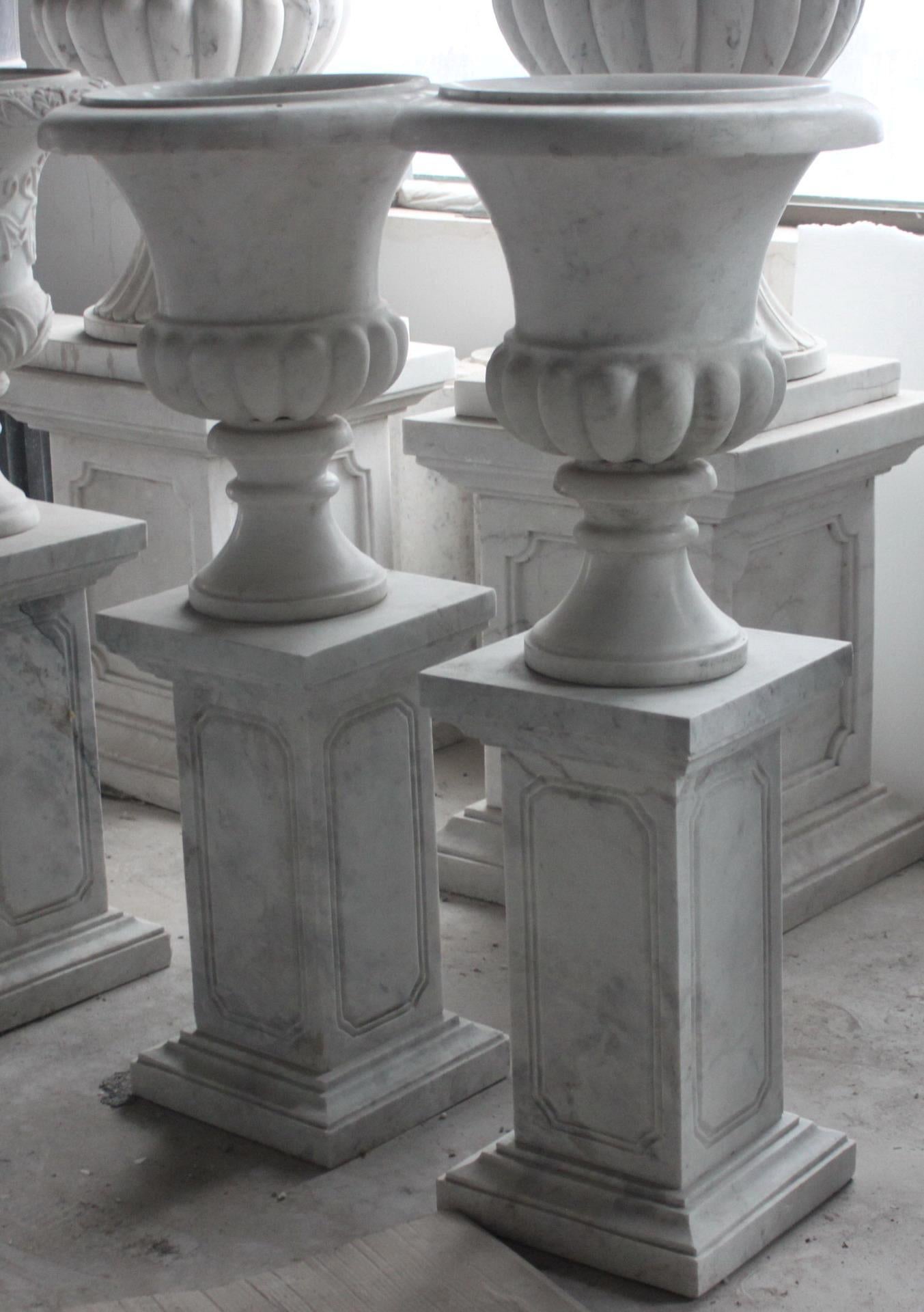 Period 
late 20th century, antique style

Composition 
carved white Hunan marble

Measures: 
Diameter 46 cm / 18 in
Height 117 cm / 46 in




Pair of Classical style carved marble urns on plinth pedestals

Heavy, fine detail. Very