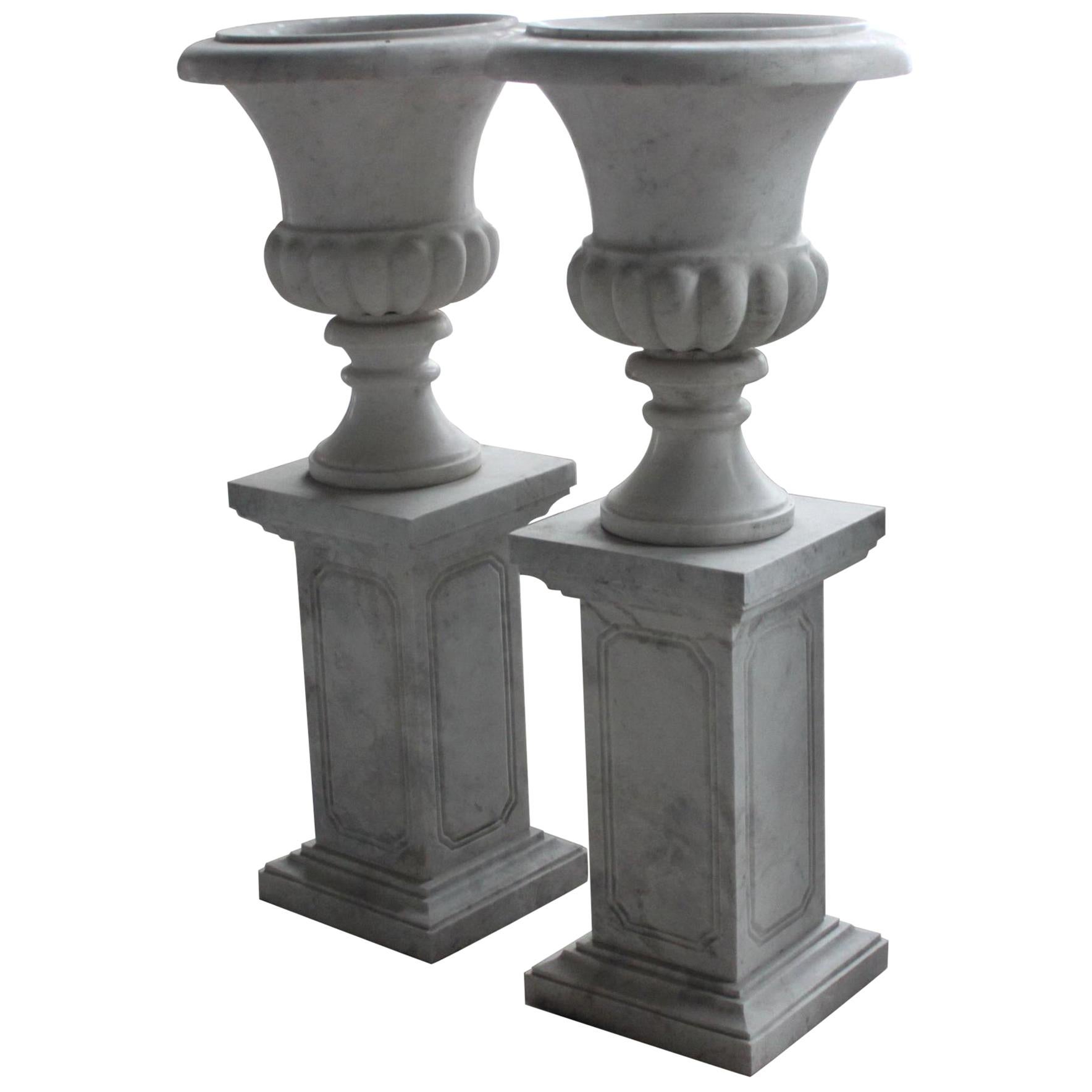 Pair of Classical Style Marble Urns on Plinths For Sale