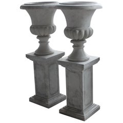Pair of Classical Style Marble Urns on Plinths