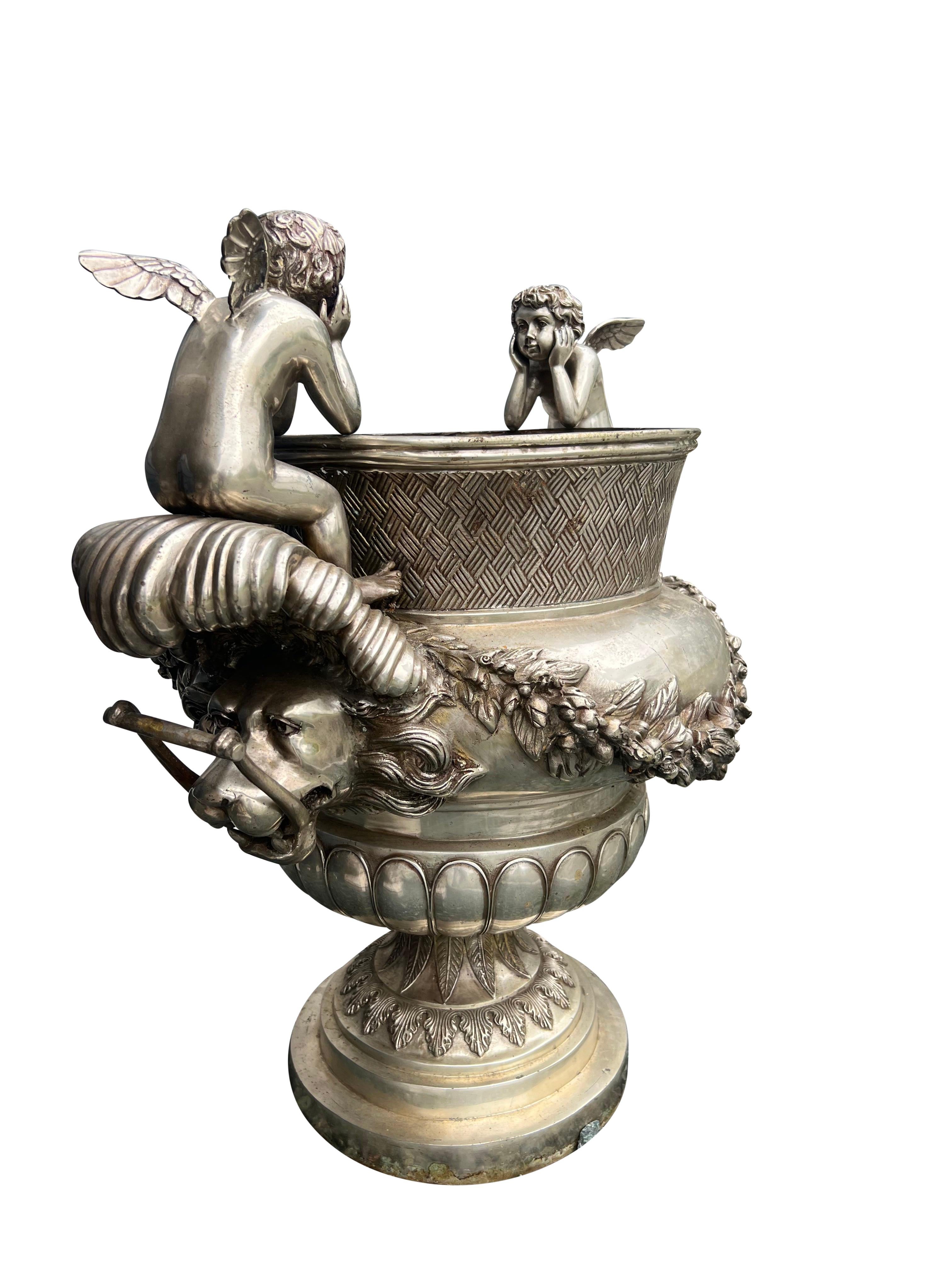Pair Of Classical Style Silvered Metal Garden Urns In Good Condition For Sale In Essex, MA