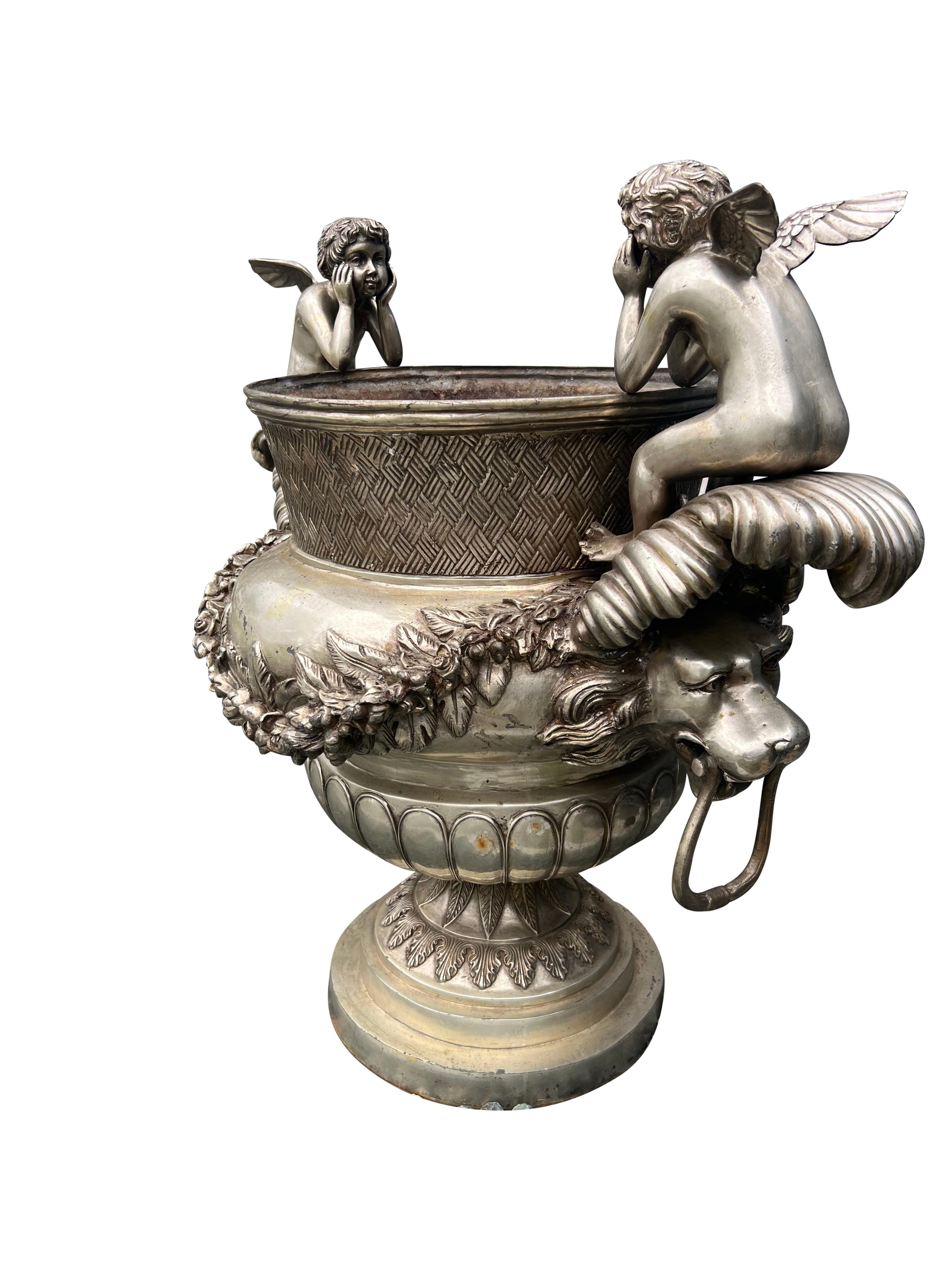 20th Century Pair Of Classical Style Silvered Metal Garden Urns For Sale