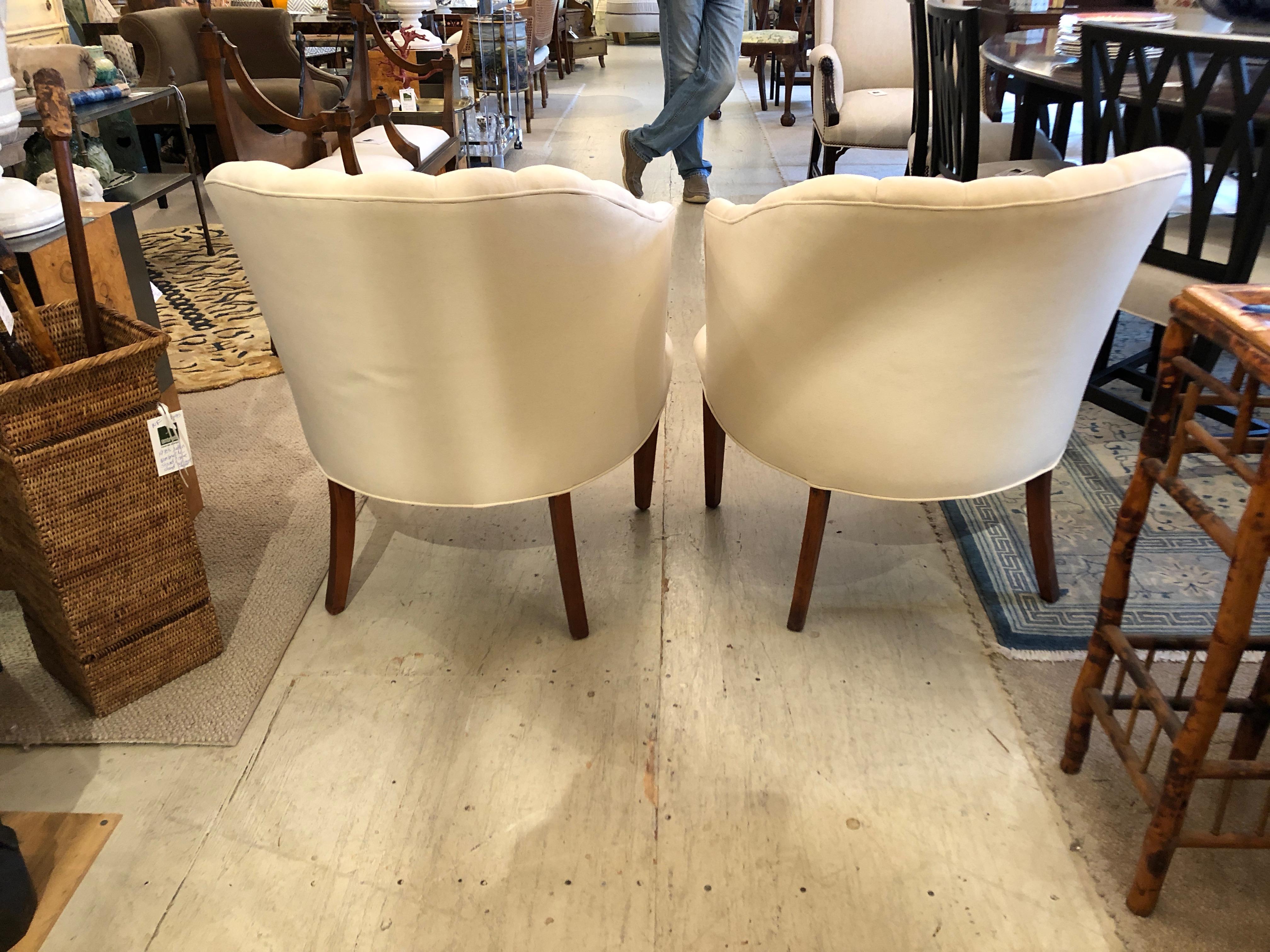 Stunning pair of newly upholstered vintage channel back club chairs having tapered mahogany legs.
Measures: seat height 16.5, seat depth 19.5.